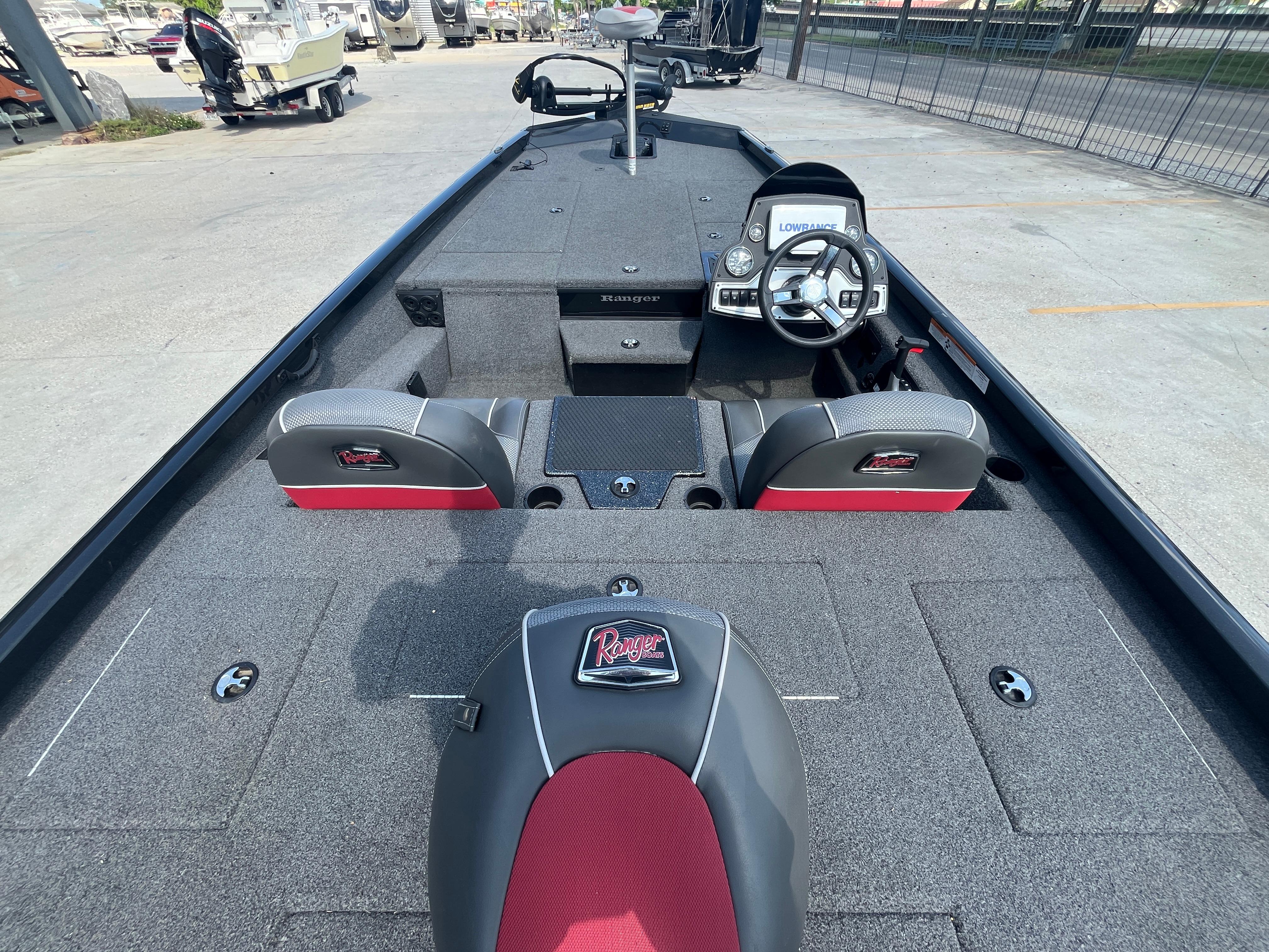 2017 Ranger RT 198P boat interior with steering wheel and seating, featuring gray and red upholstery.
