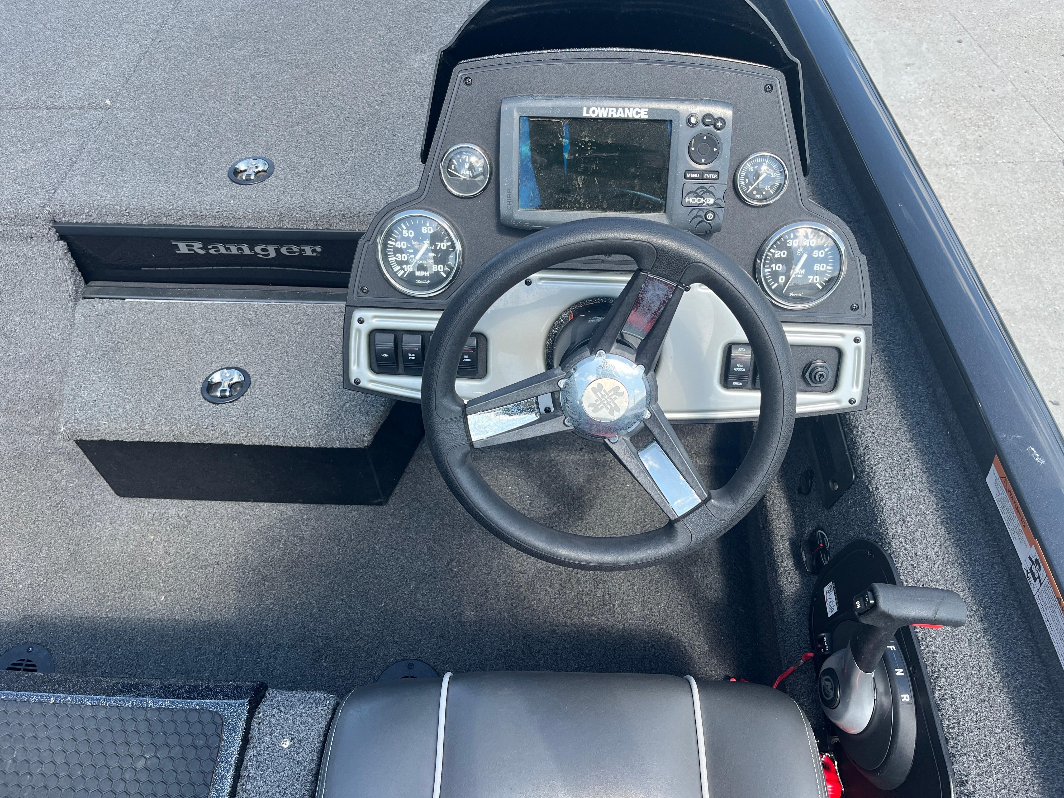 2017 Ranger RT 198P boat dashboard with steering wheel and navigation system.