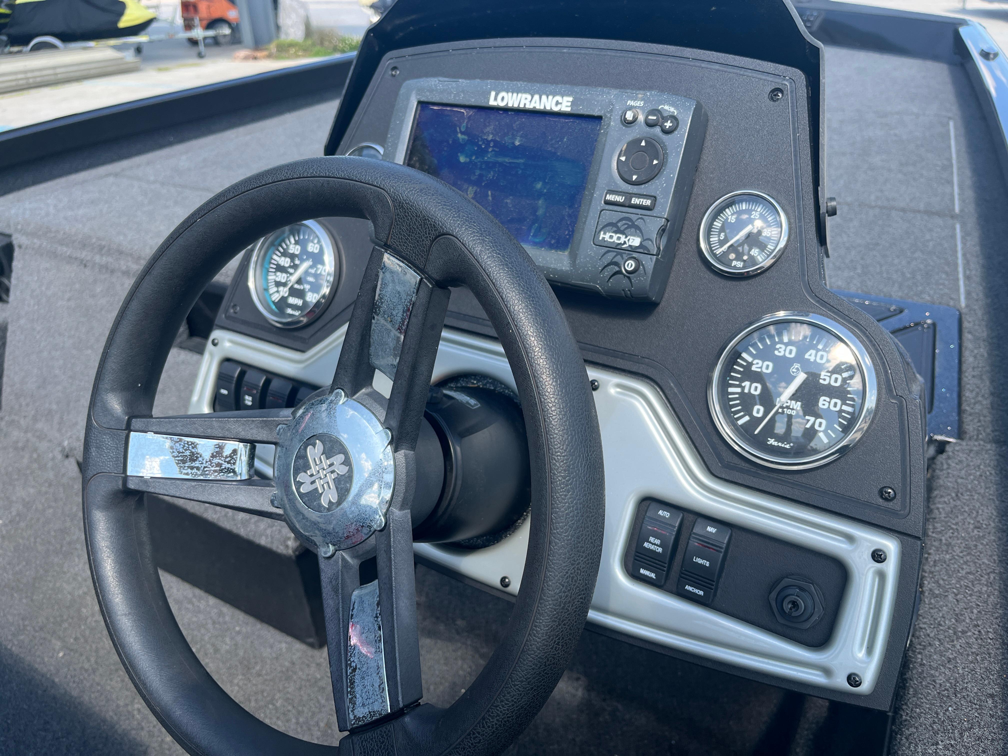 Steering wheel and dashboard of 2017 Ranger RT 198P boat with Lowrance display.