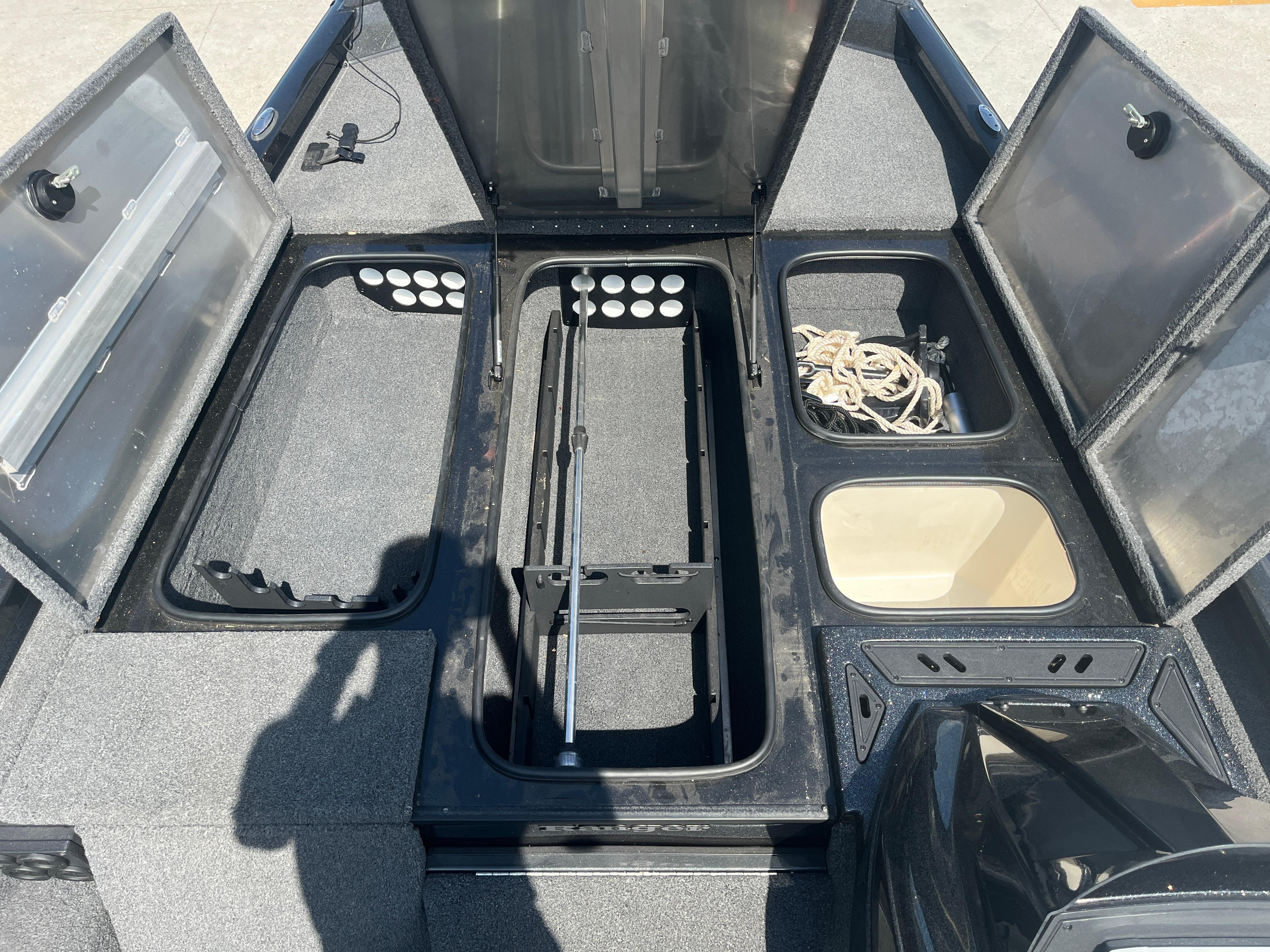 2017 Ranger RT 198P boat storage compartments open, showcasing organized interior layout.