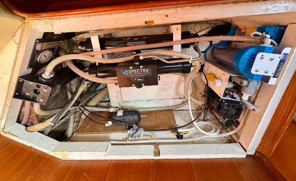 1983 Tayana 52 Aft Cockpit yacht engine compartment with Spectra watermaker system.
