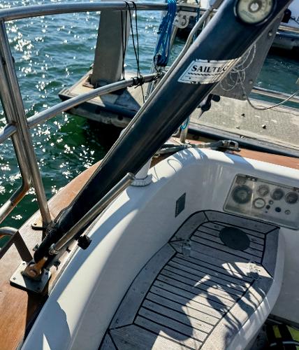 1983 Tayana 52 Aft Cockpit sailboat, docked with visible deck and railing.
