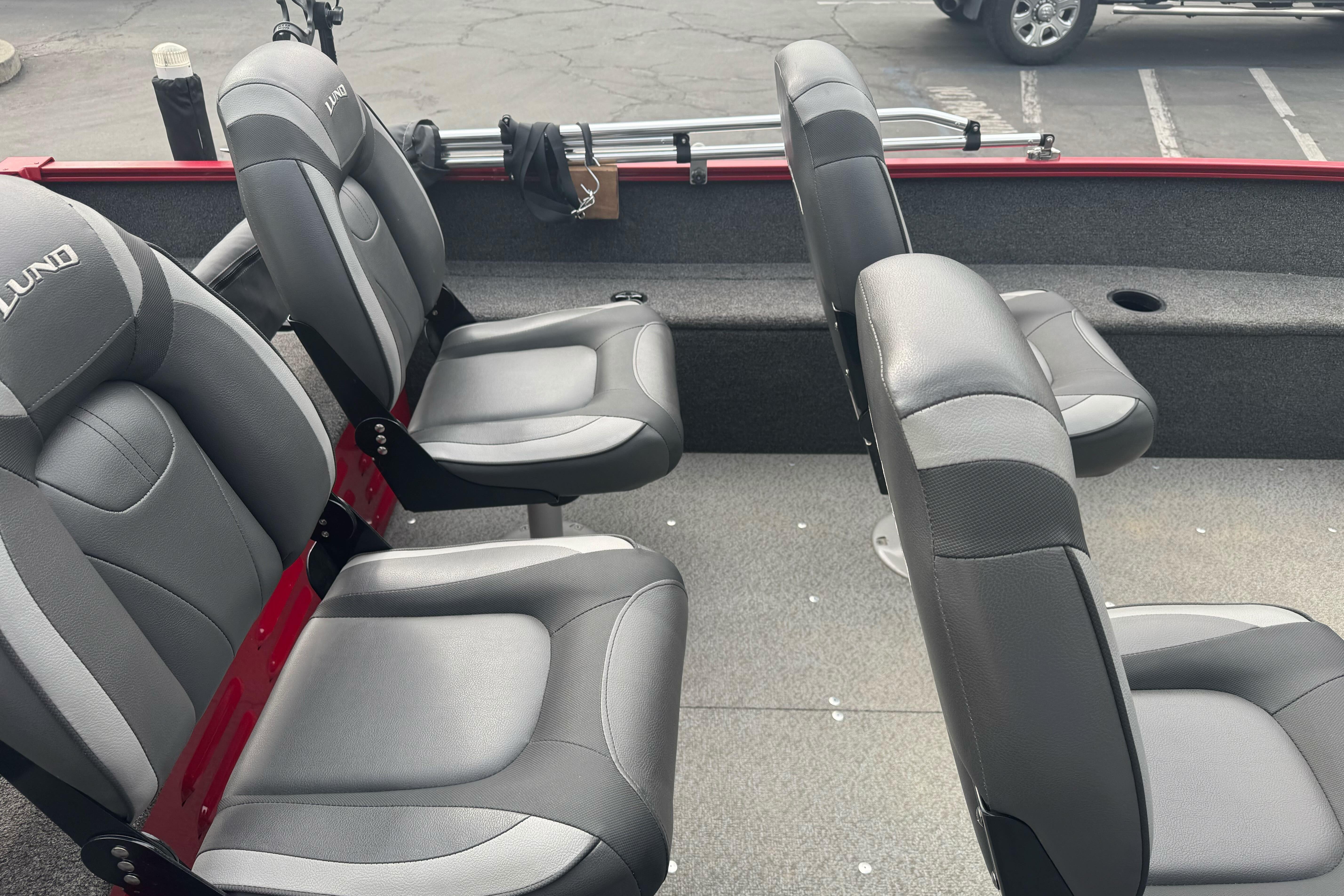 2021 Lund 1650 Angler SS boat interior with gray seating and red accents.