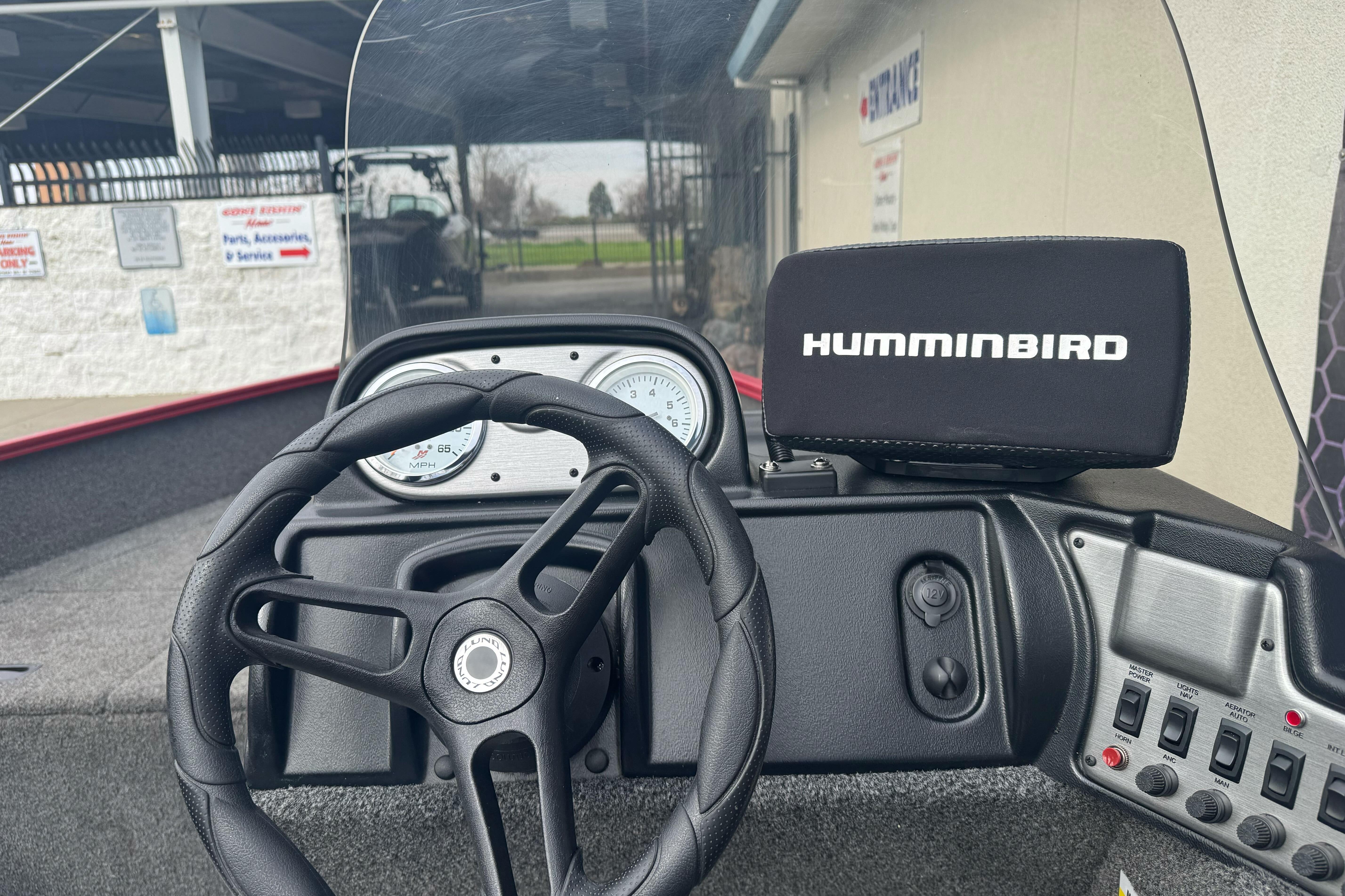 2021 Lund 1650 Angler SS dashboard with Humminbird fish finder and steering wheel.