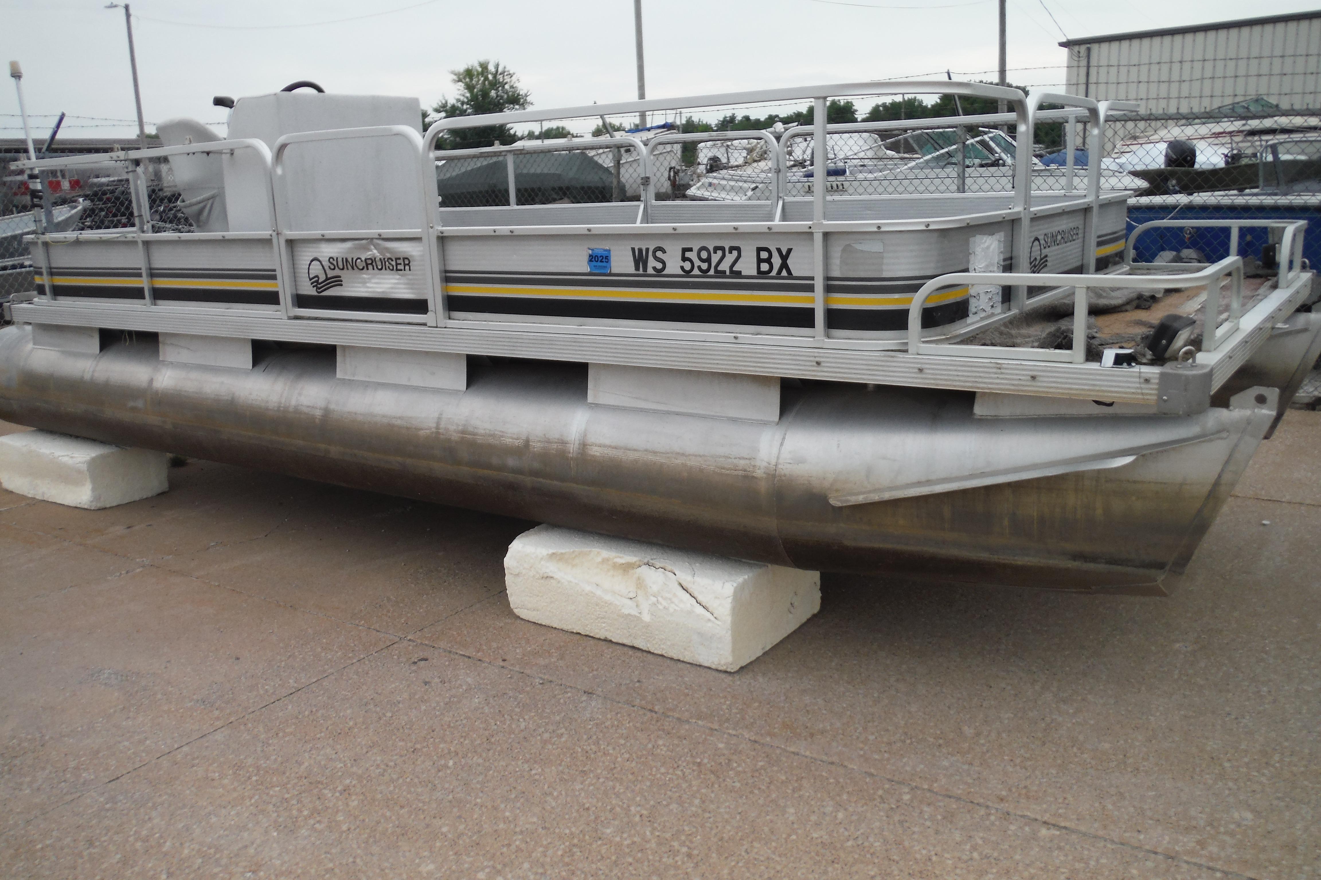 1989 Sea Nymph SS200 SUNCRUISER pontoon boat on display, resting on blocks.