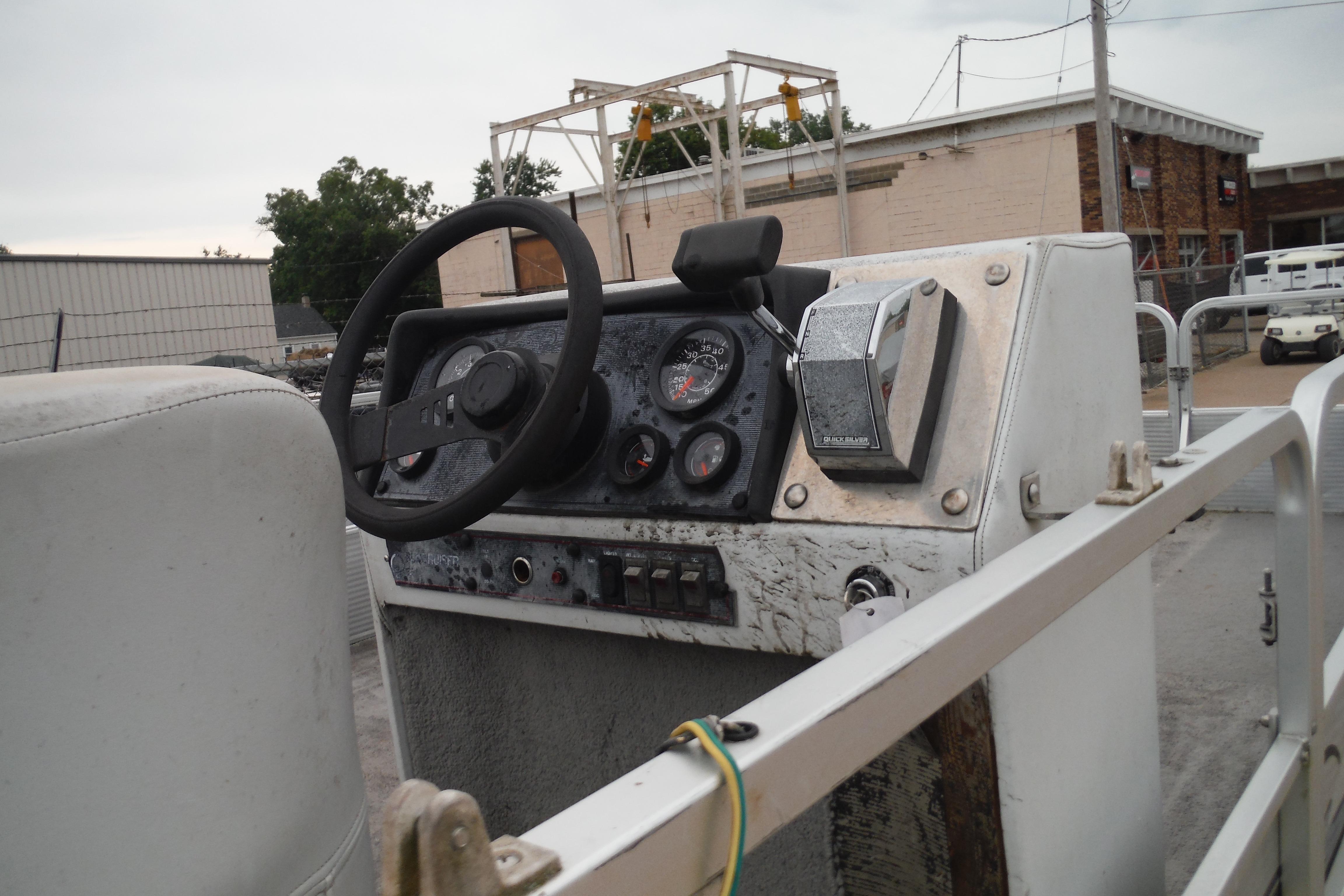 1989 Sea Nymph SS200 SUNCRUISER boat dashboard with steering wheel and control panel.