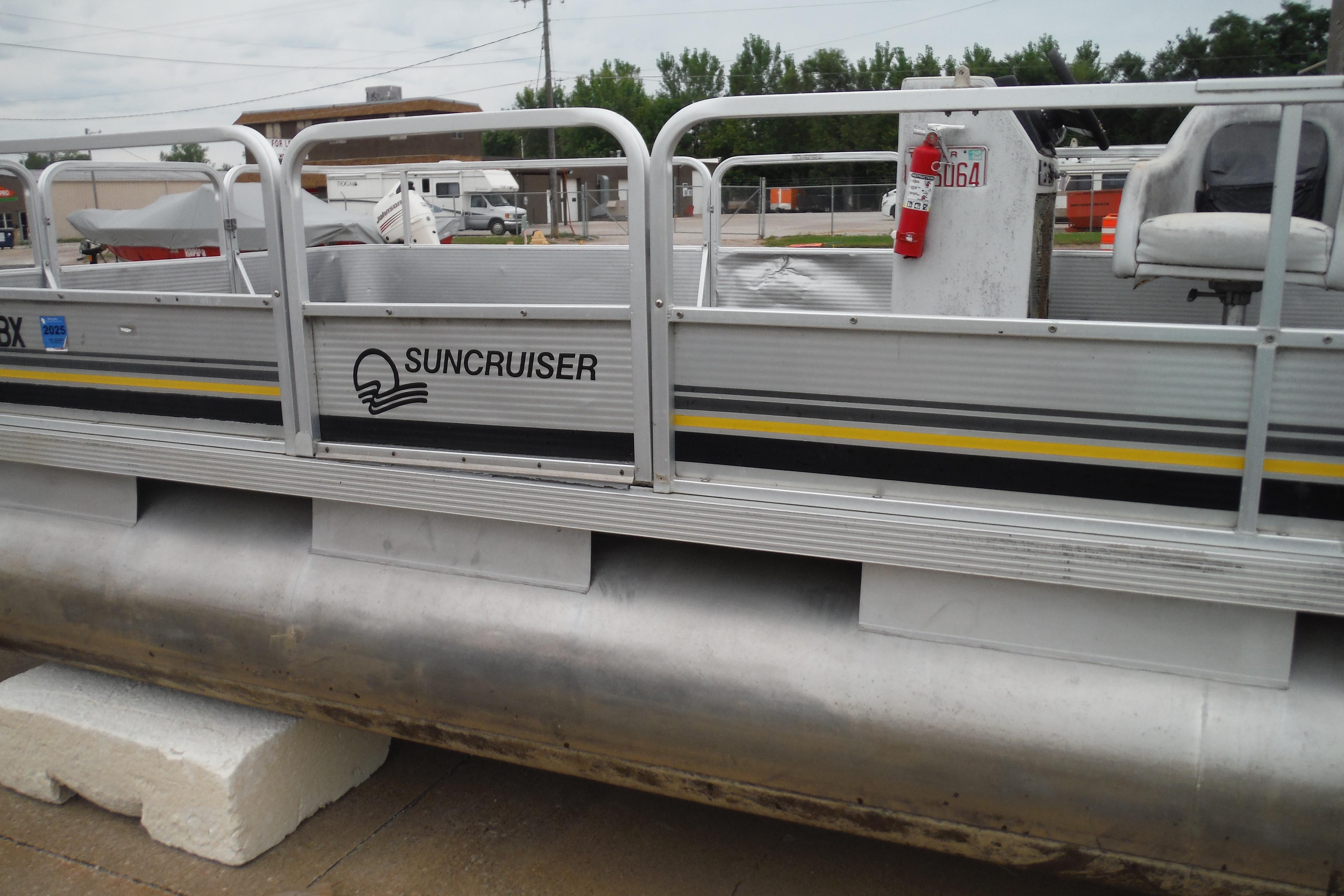 1989 Sea Nymph SS200 SUNCRUISER pontoon boat docked on land.
