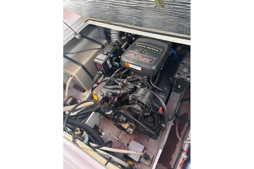 Engine compartment of a 2000 Four Winns 238 Vista boat with Volvo Penta engine.