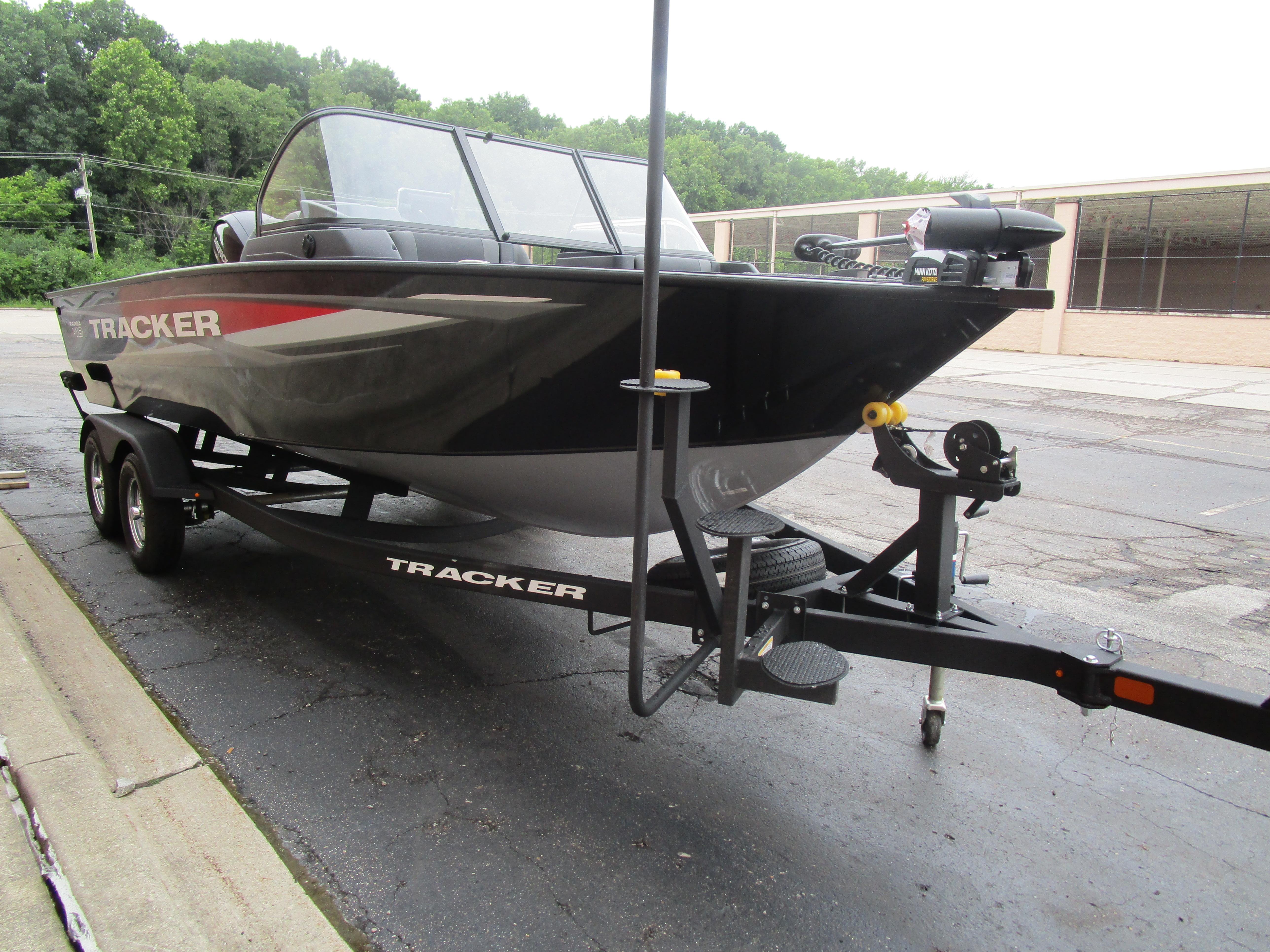 2026 Tracker Targa 18 WT boat on trailer, parked outdoors.