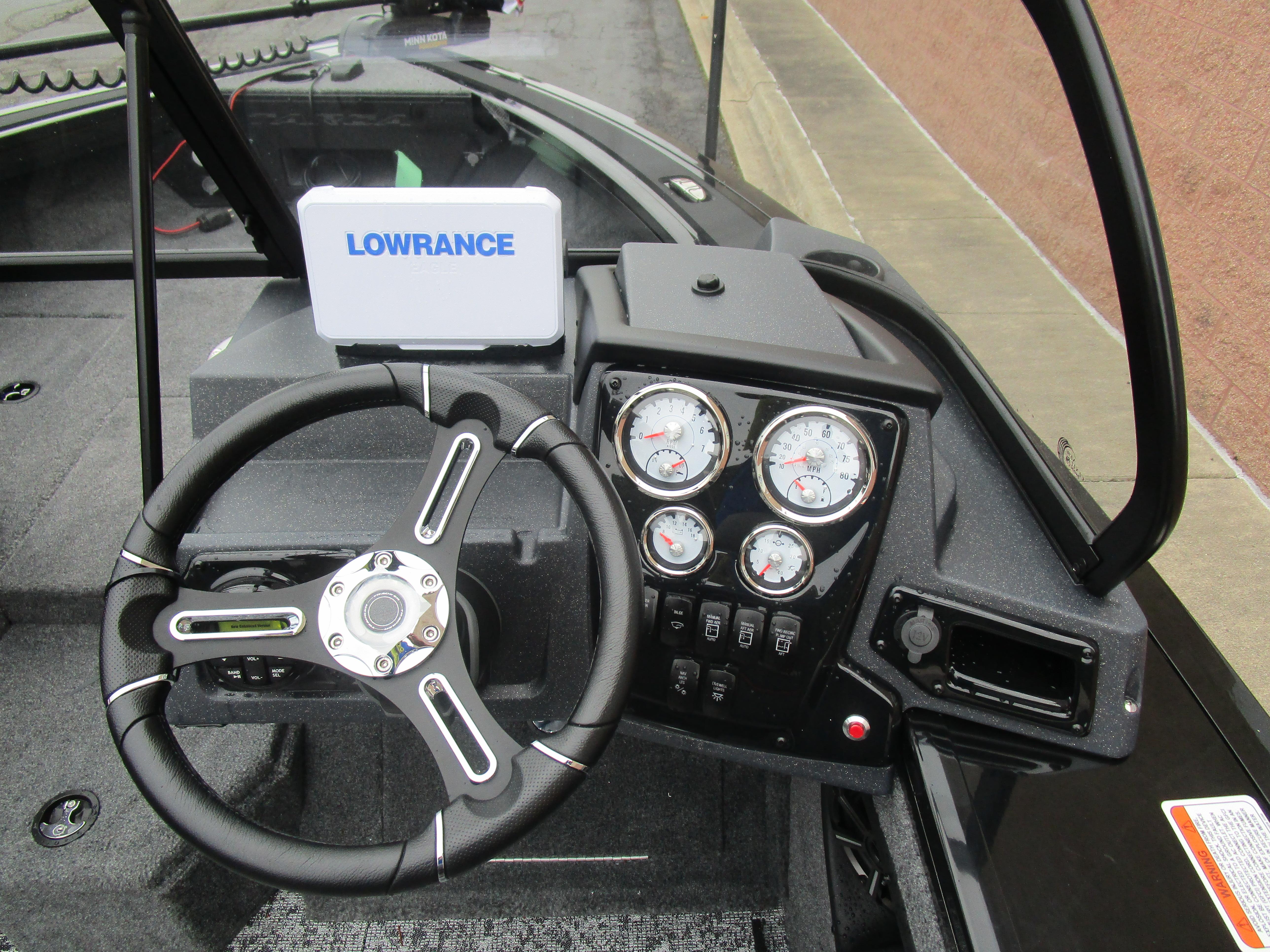 2026 Tracker Targa 18 WT dashboard with steering wheel and Lowrance display.
