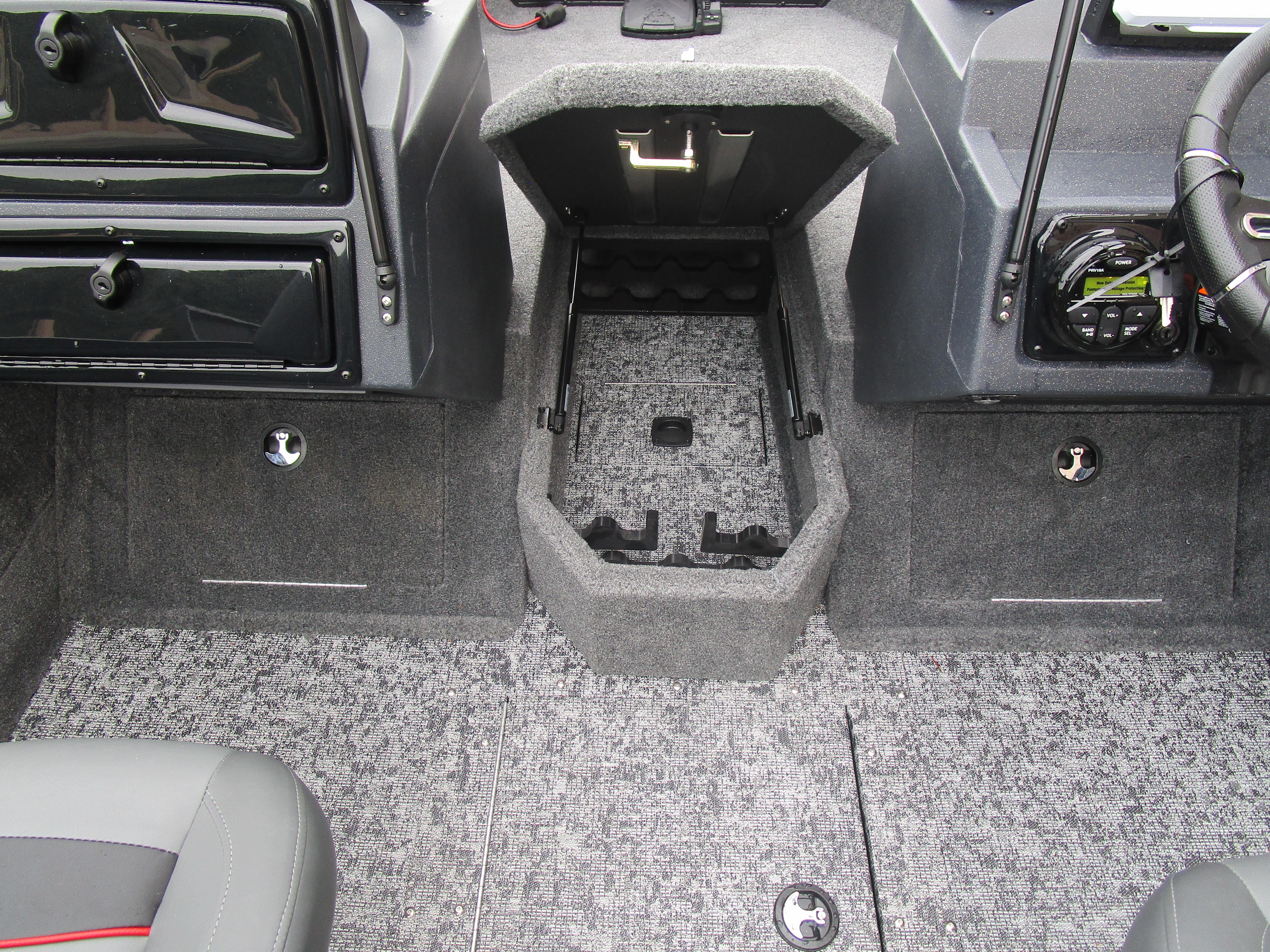 Interior of 2026 Tracker Targa 18 WT boat showing storage compartments and dashboard.