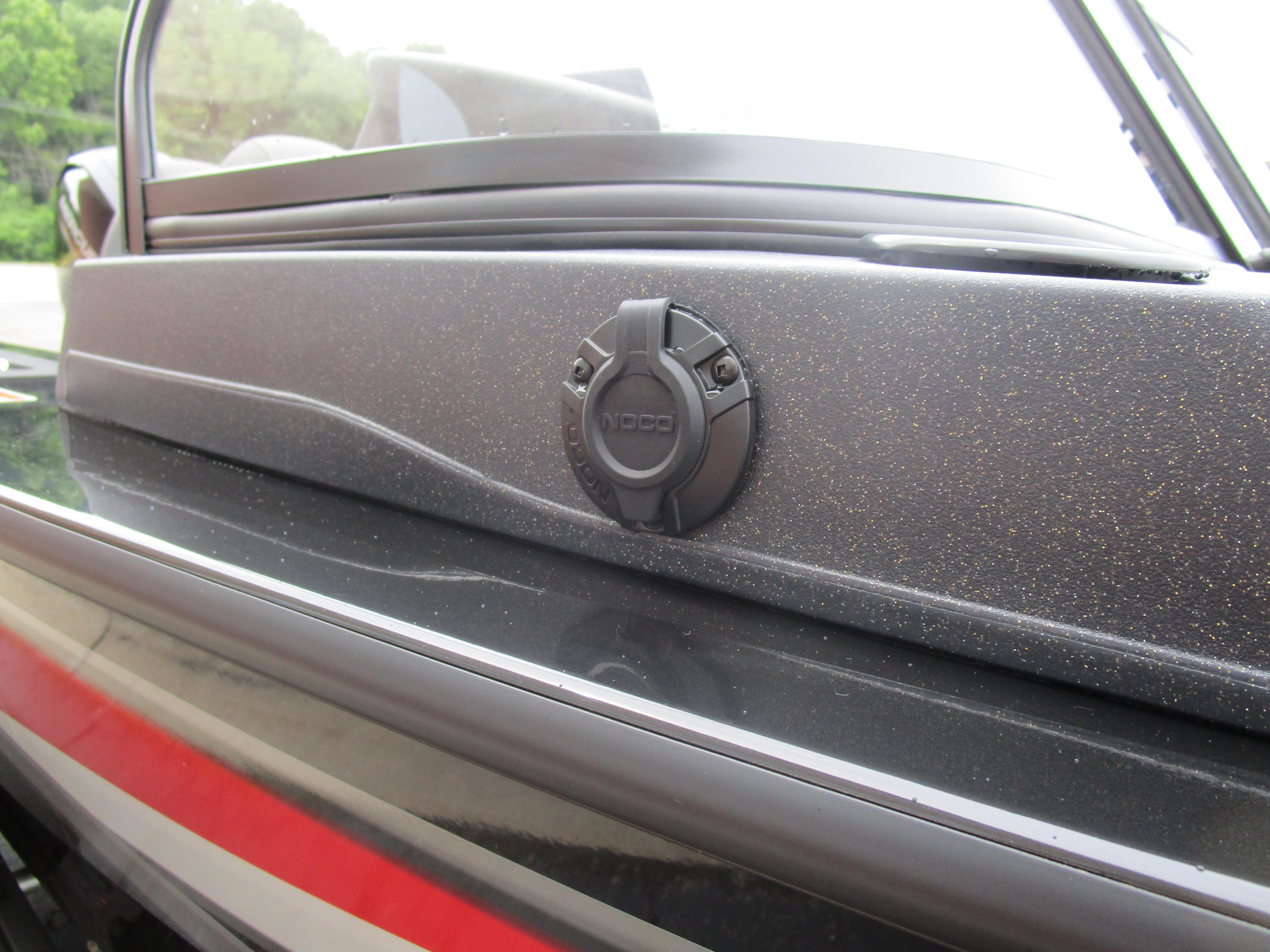 2026 Tracker Targa 18 WT boat detail with sleek black finish and NOCO plug.