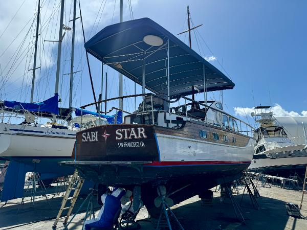 1966 Rampart 48 boat named "Sabi Star" in a marina, San Francisco, CA.