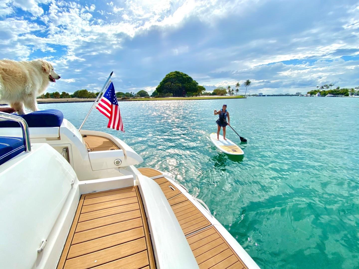 Fairline-Targa 52 2007-Mahalo FL-US-2007 Fairline Targa 52 yacht with dog and paddleboarder on scenic water.-9807222 | Thumbnail
