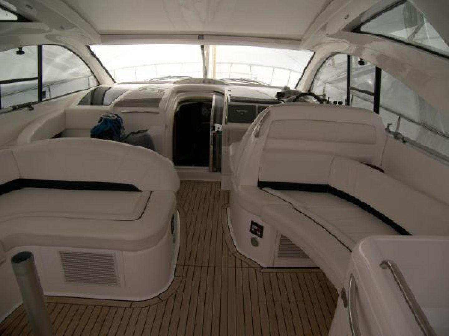 Fairline-Targa 52 2007-Mahalo FL-US-Interior of 2007 Fairline Targa 52 yacht with sleek white seating and wooden flooring.-9807222 | Thumbnail