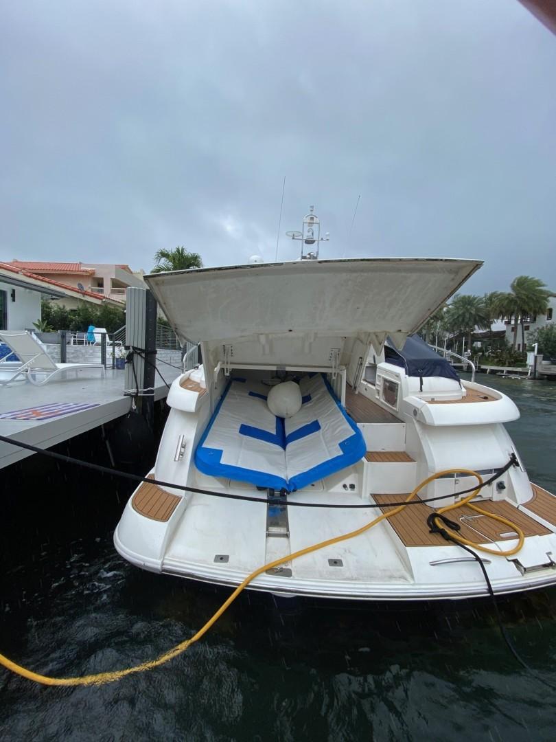 Fairline-Targa 52 2007-Mahalo FL-US-2007 Fairline Targa 52 yacht docked with open garage and paddleboard.-9807222 | Thumbnail