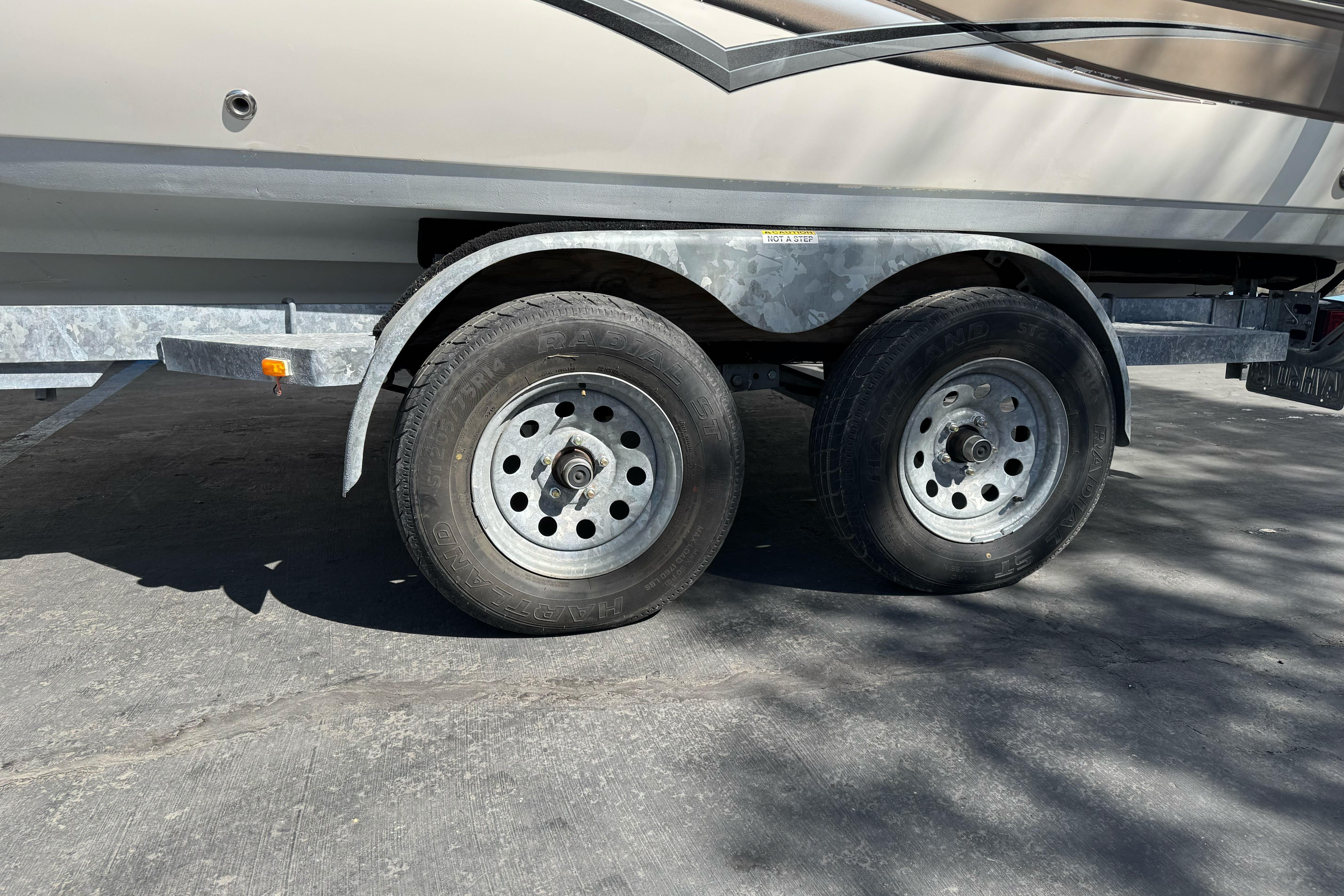 Trailer with dual wheels for 2007 Hurricane SunDeck 217 OB boat.