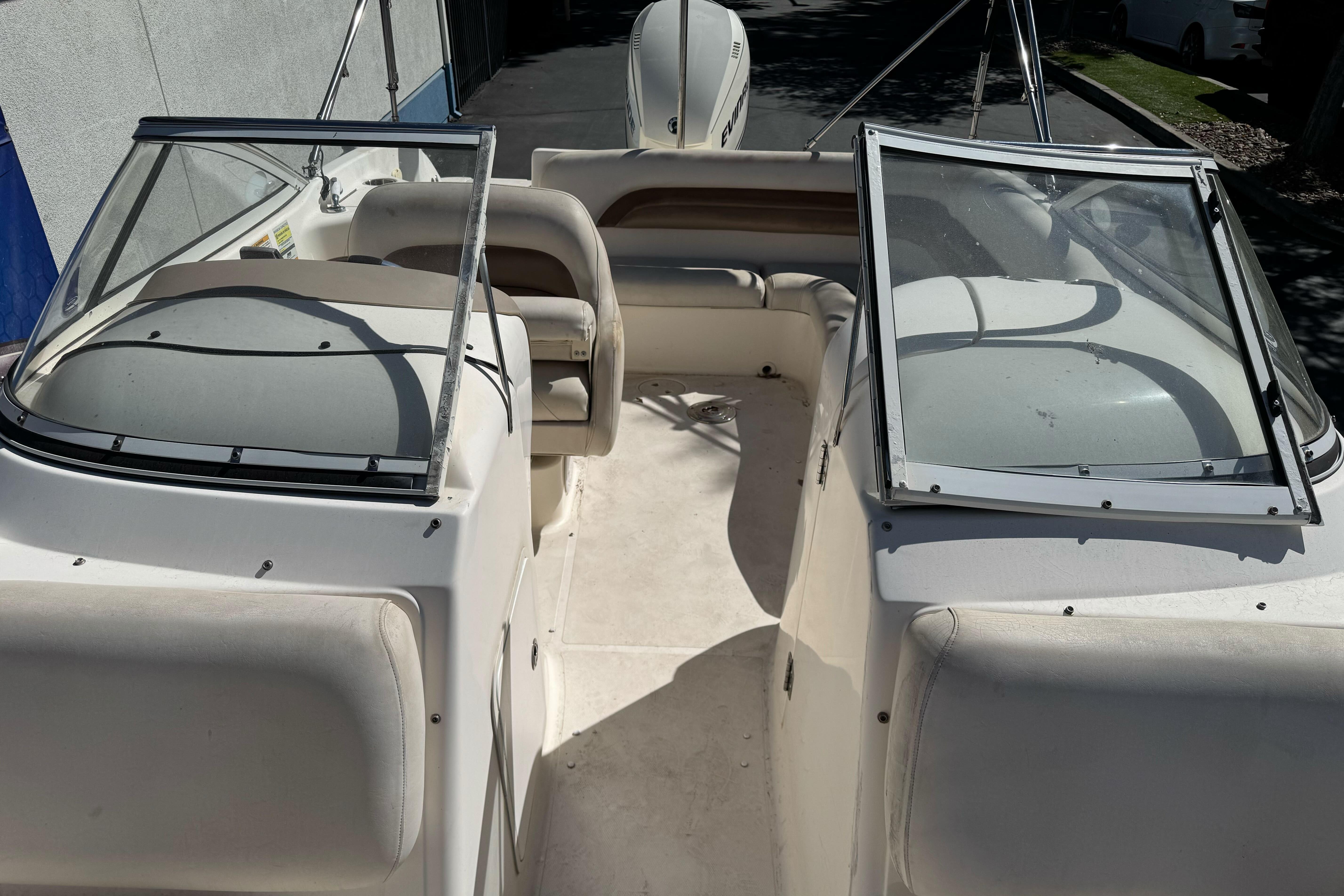 2007 Hurricane SunDeck 217 OB boat interior with seating and windshield.