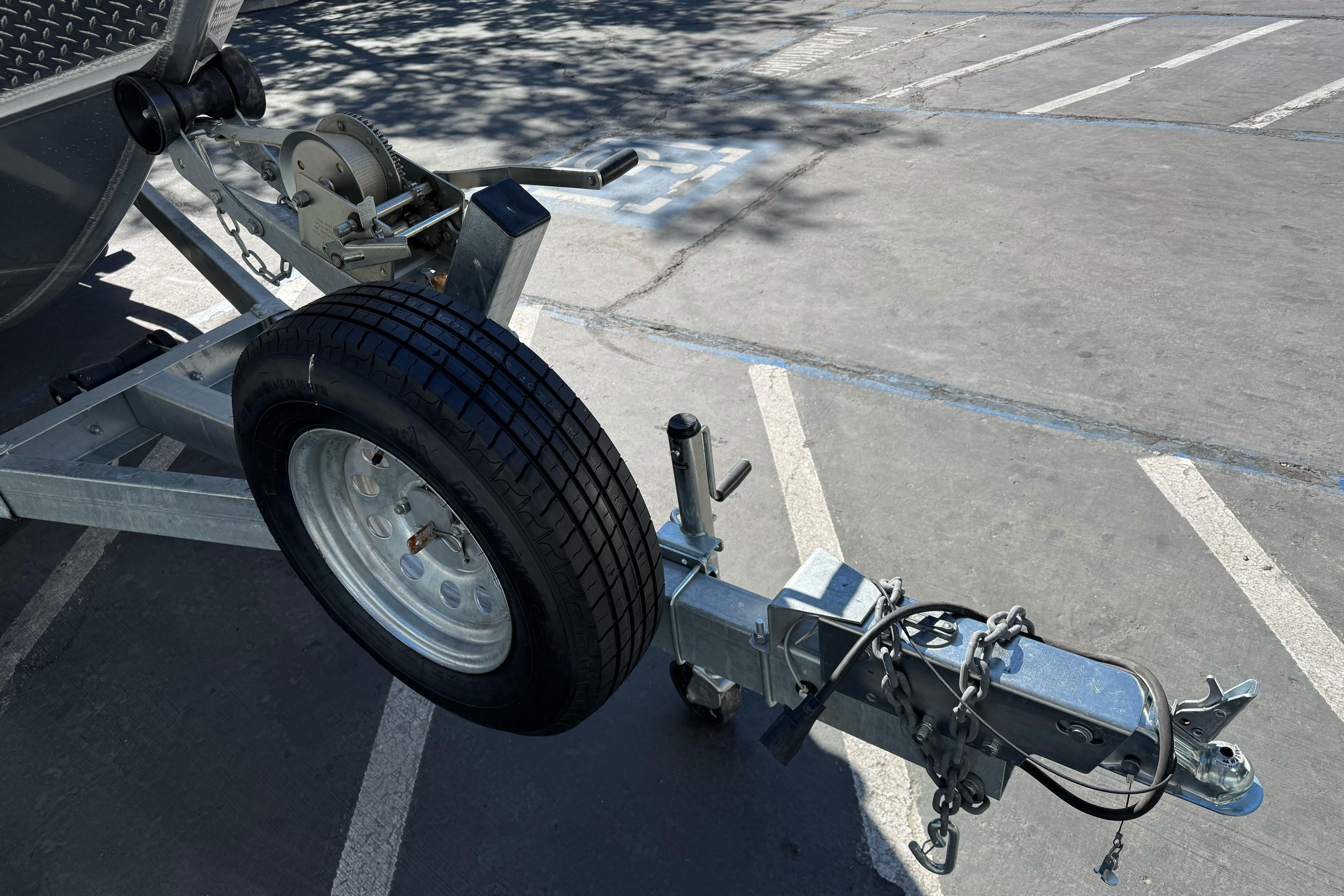 Trailer hitch and wheel of 2023 North River 21 X 84 Seahawk boat.