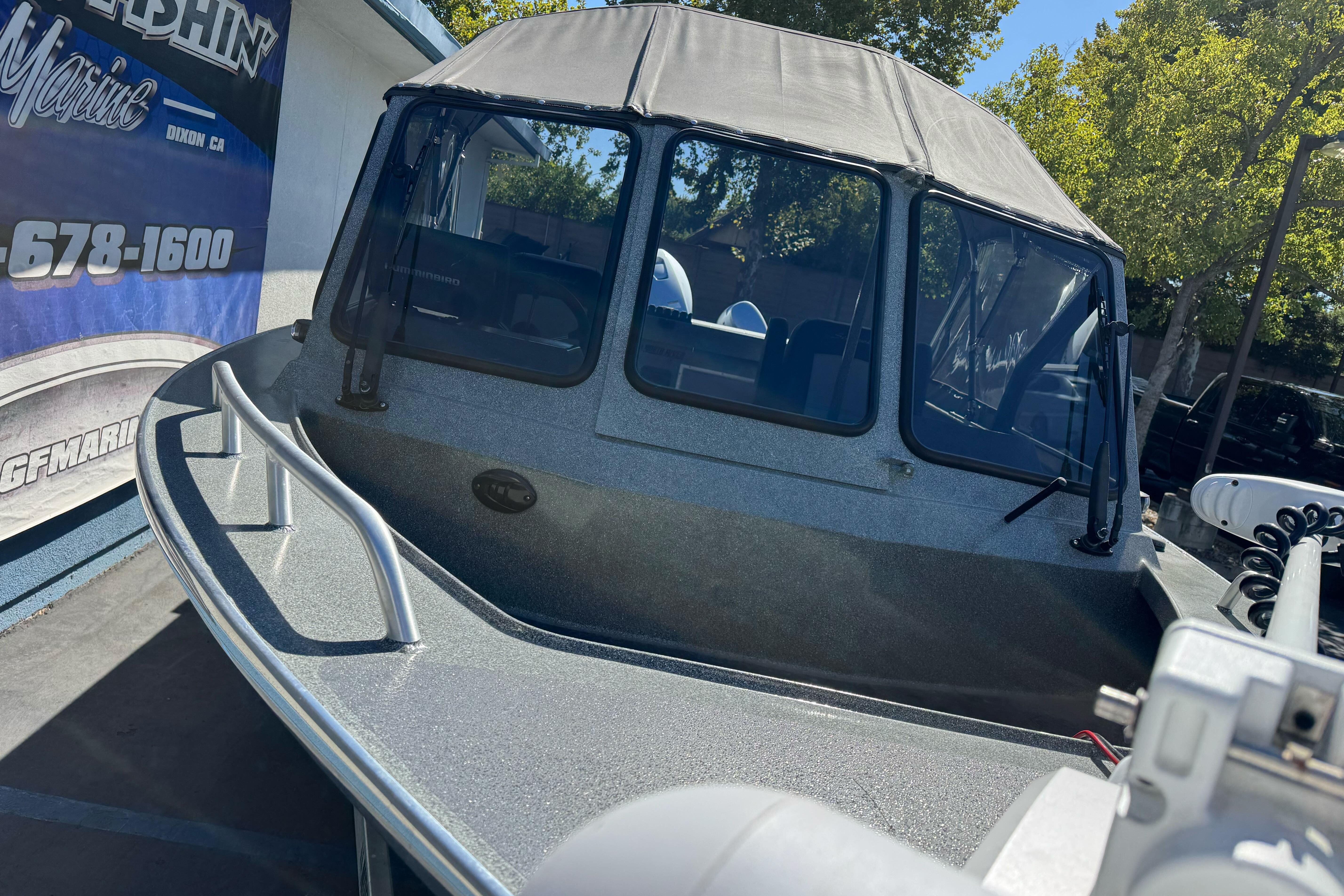 2023 North River 21 X 84 Seahawk boat with canopy, displayed outdoors.