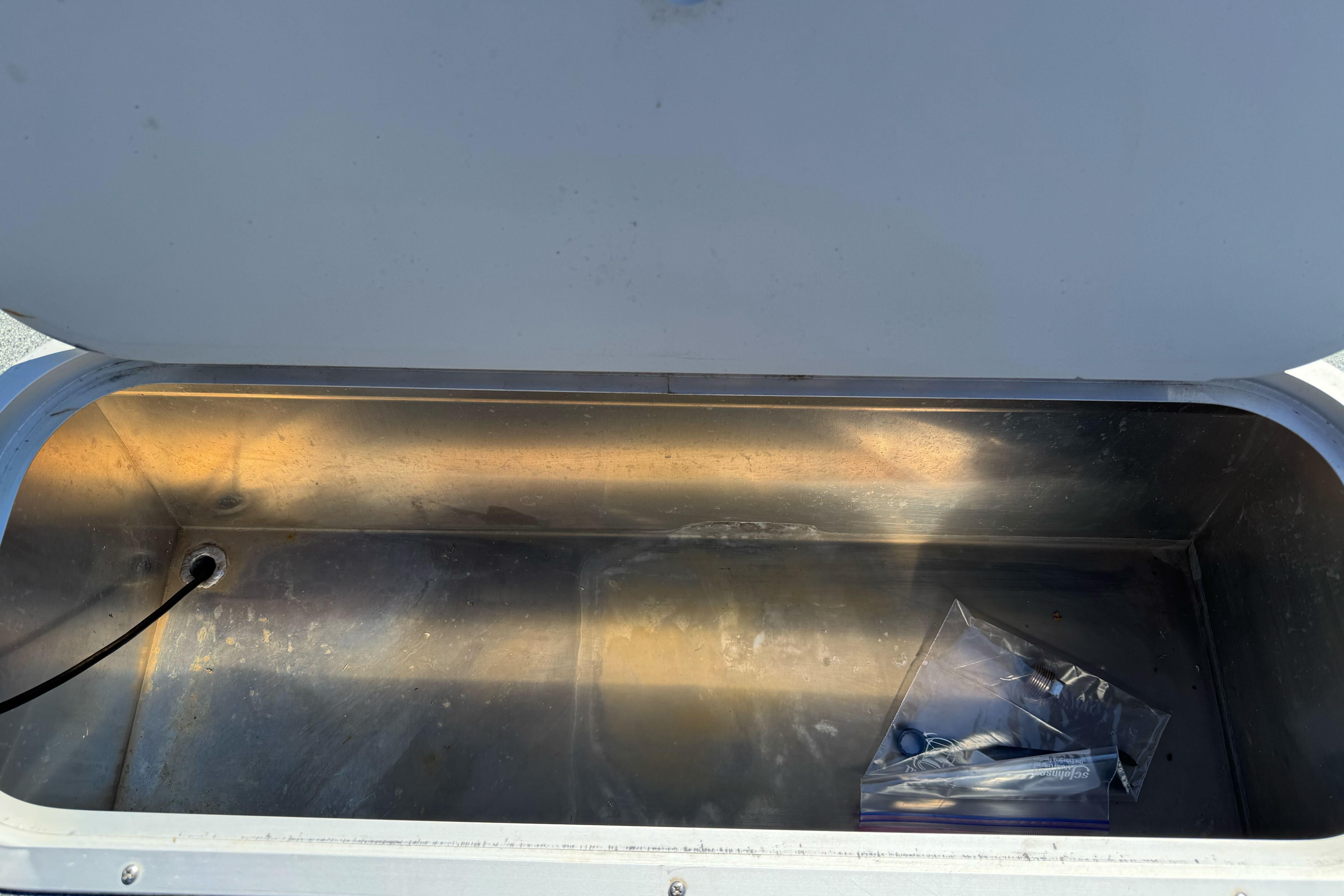 Open storage compartment in 2023 North River 21 X 84 Seahawk boat.
