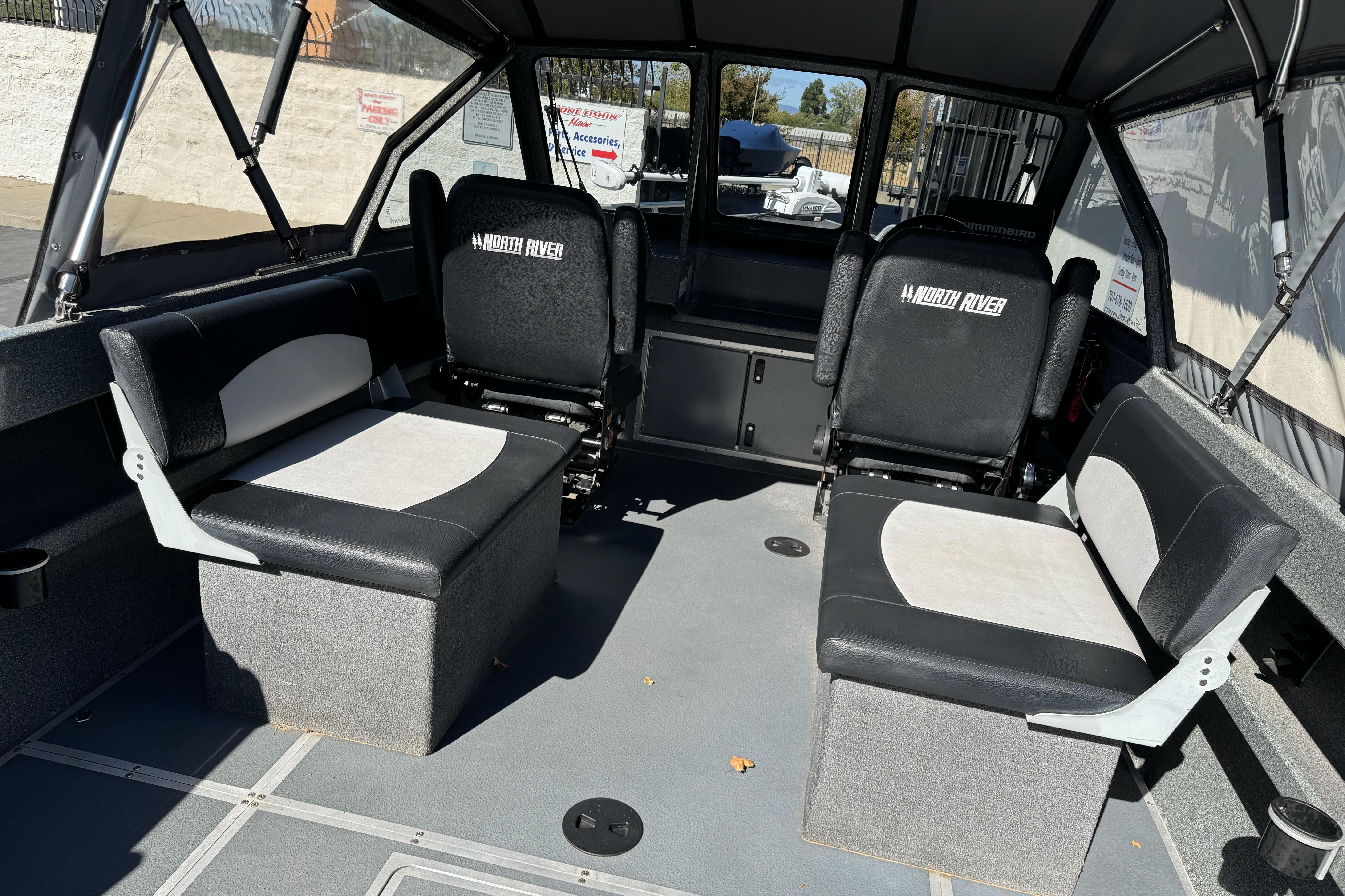 Interior of 2023 North River 21 X 84 Seahawk boat with seating arrangement.