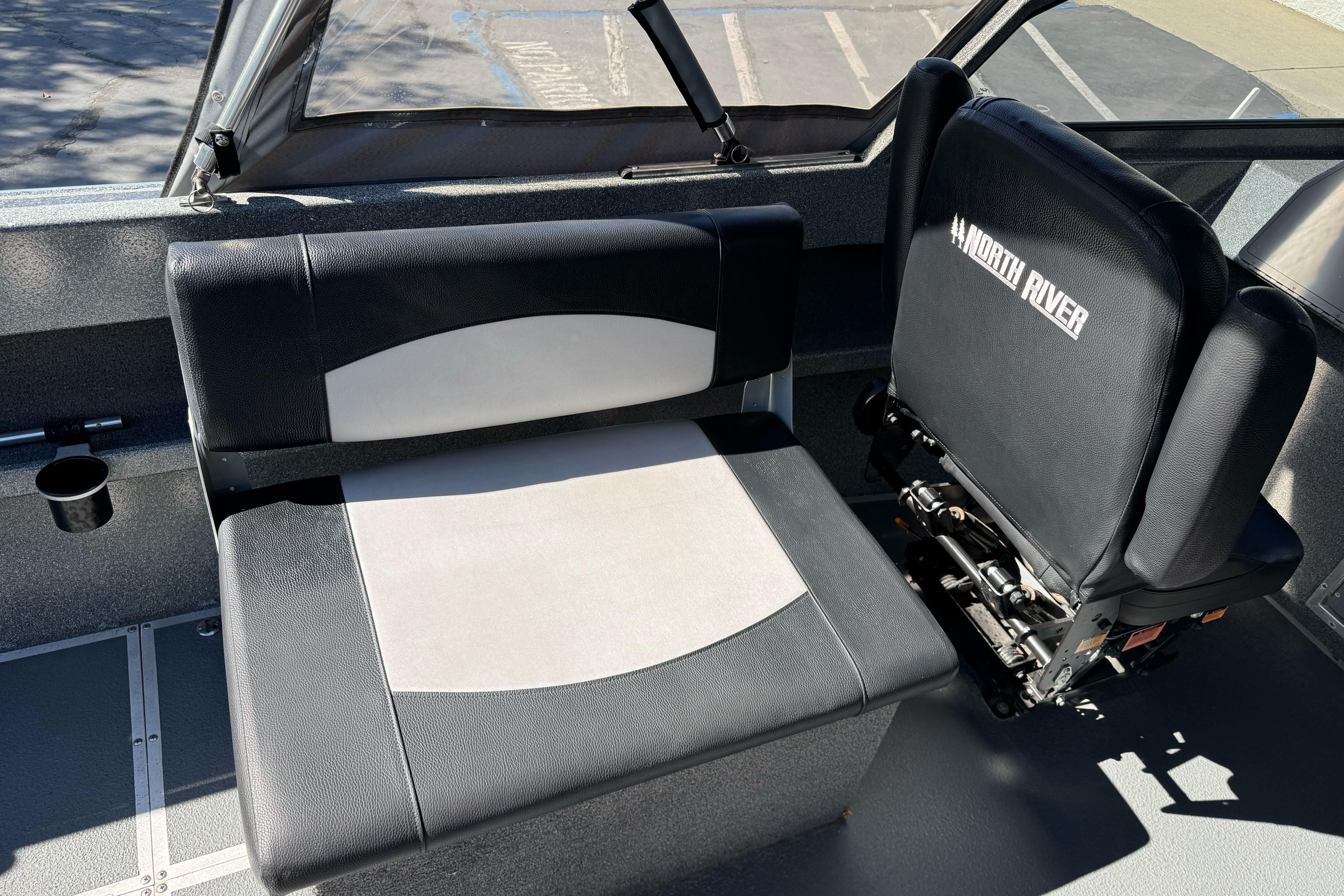 2023 North River 21 X 84 Seahawk interior seating with black and white upholstery.