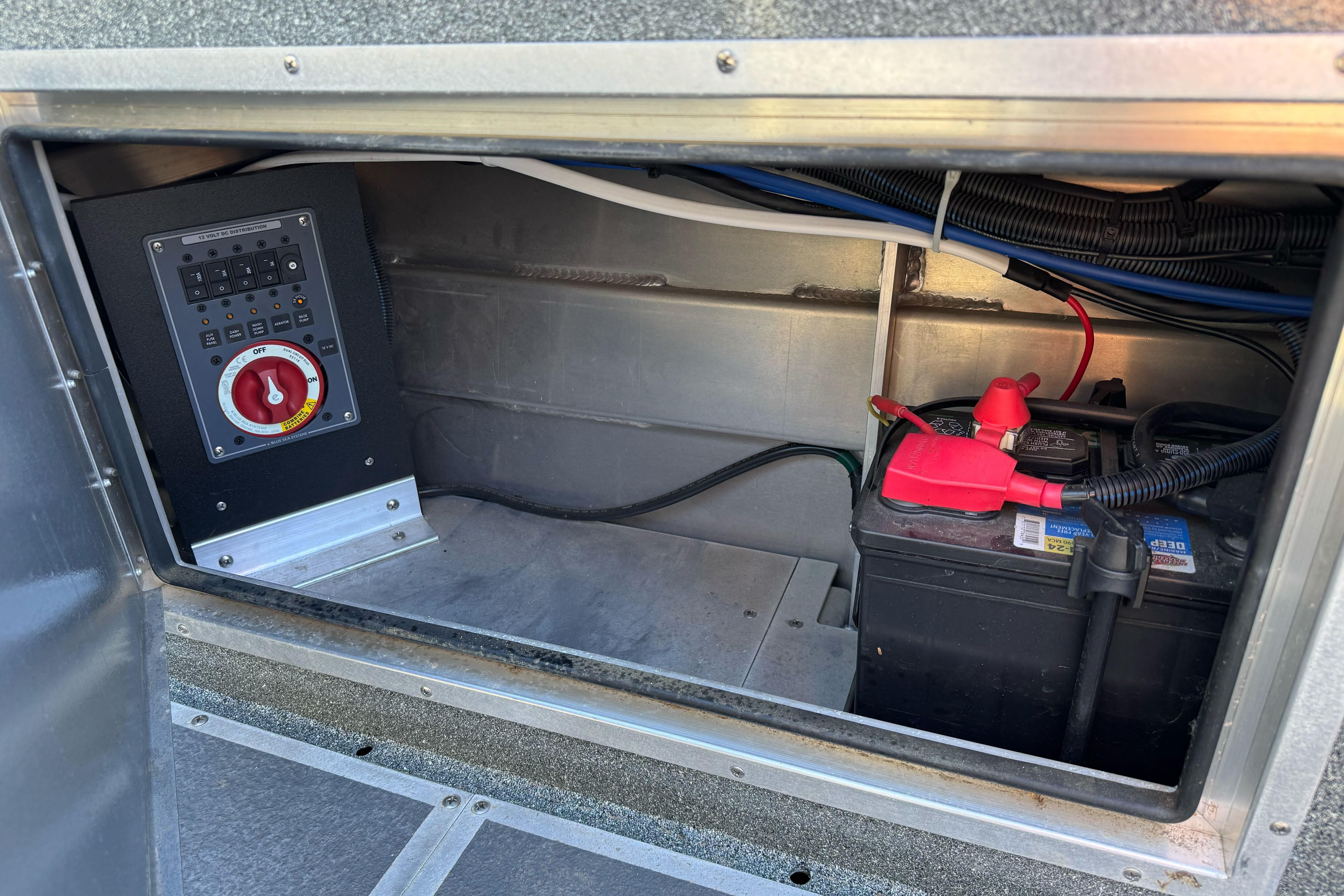 2023 North River 21 X 84 Seahawk battery compartment with control panel and wiring.