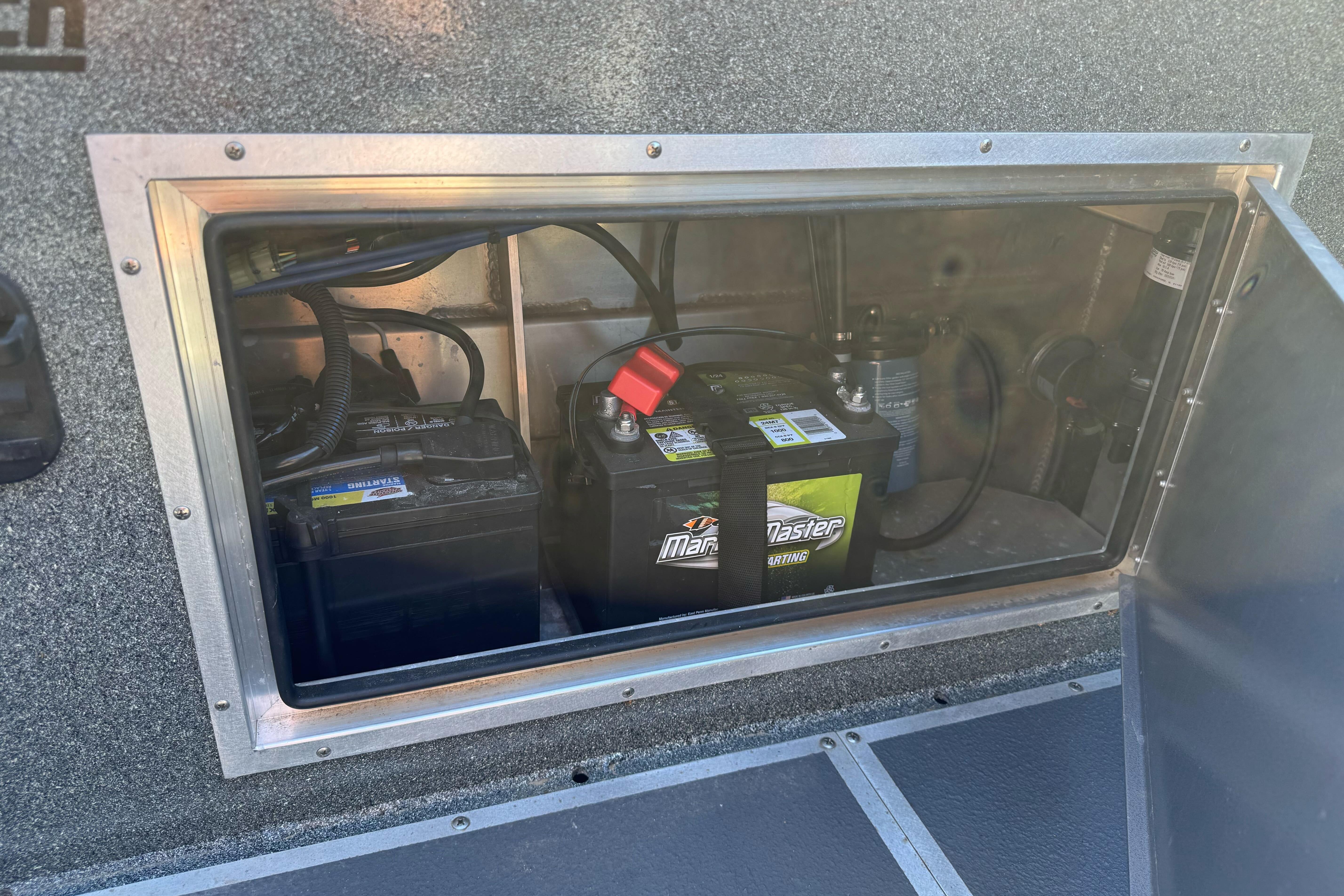 Battery compartment of 2023 North River 21 X 84 Seahawk boat, featuring marine batteries.