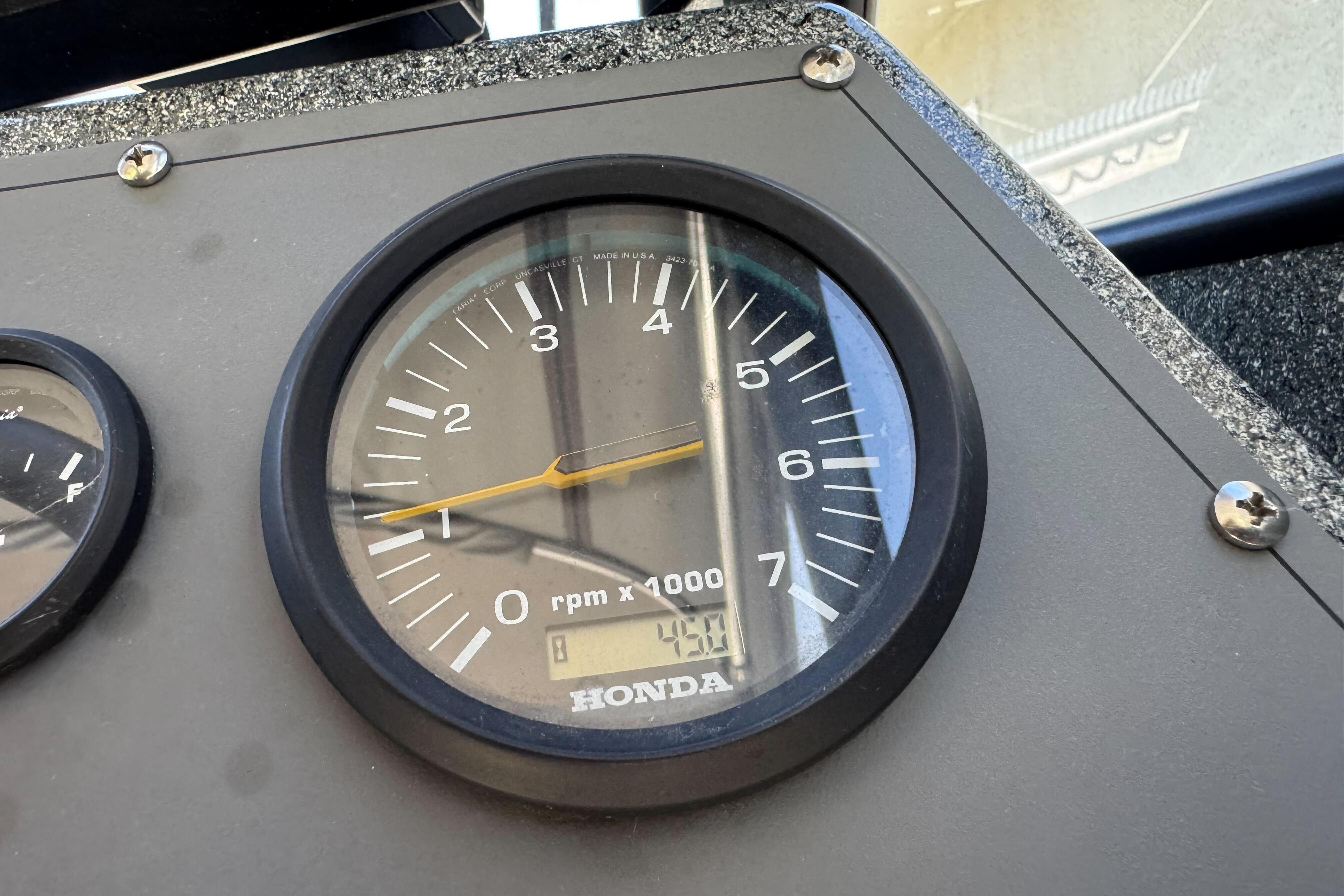 Close-up of a Honda tachometer on a 2023 North River 21 X 84 Seahawk boat.