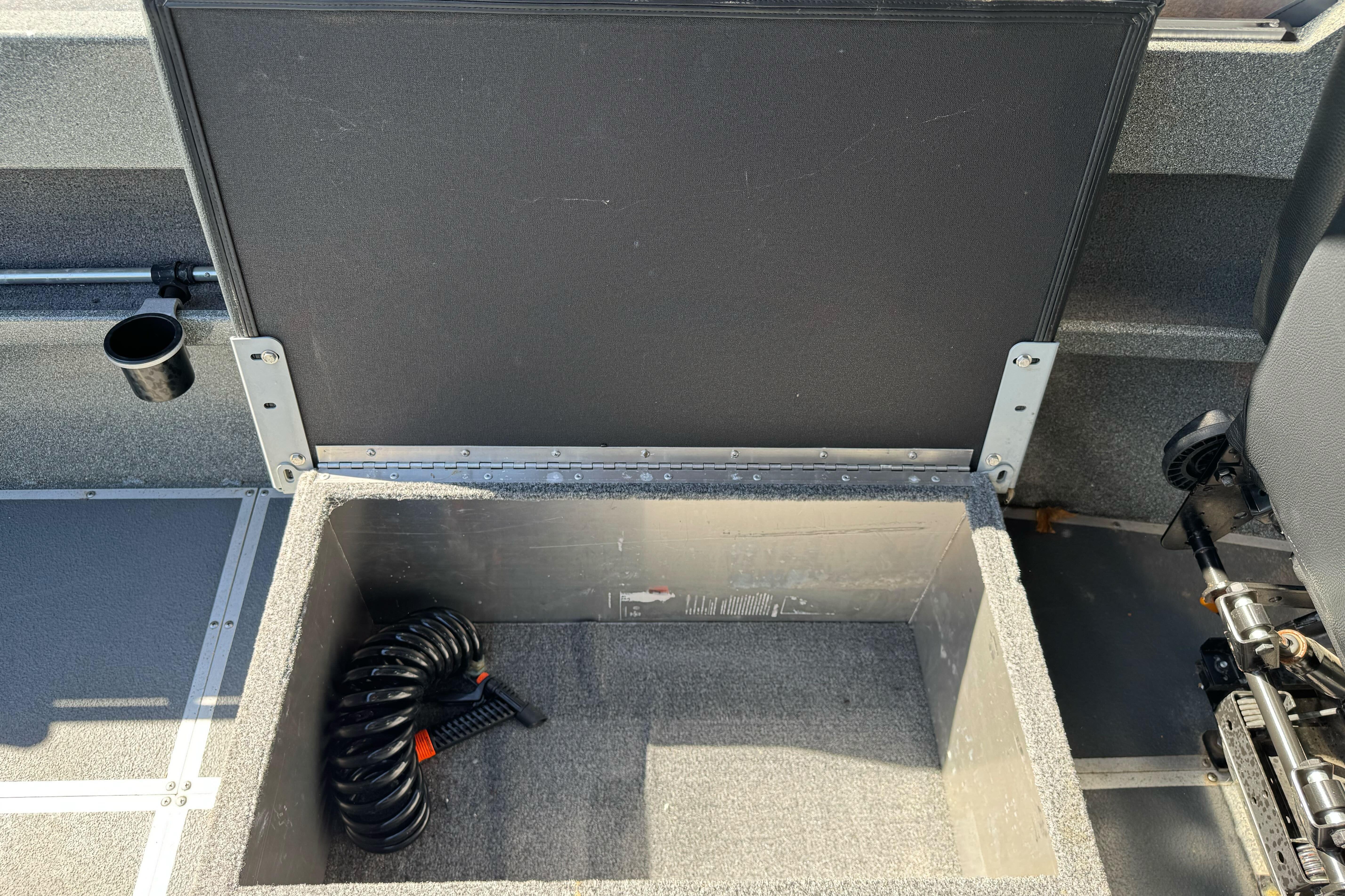 Open storage compartment in 2023 North River 21 X 84 Seahawk boat interior.