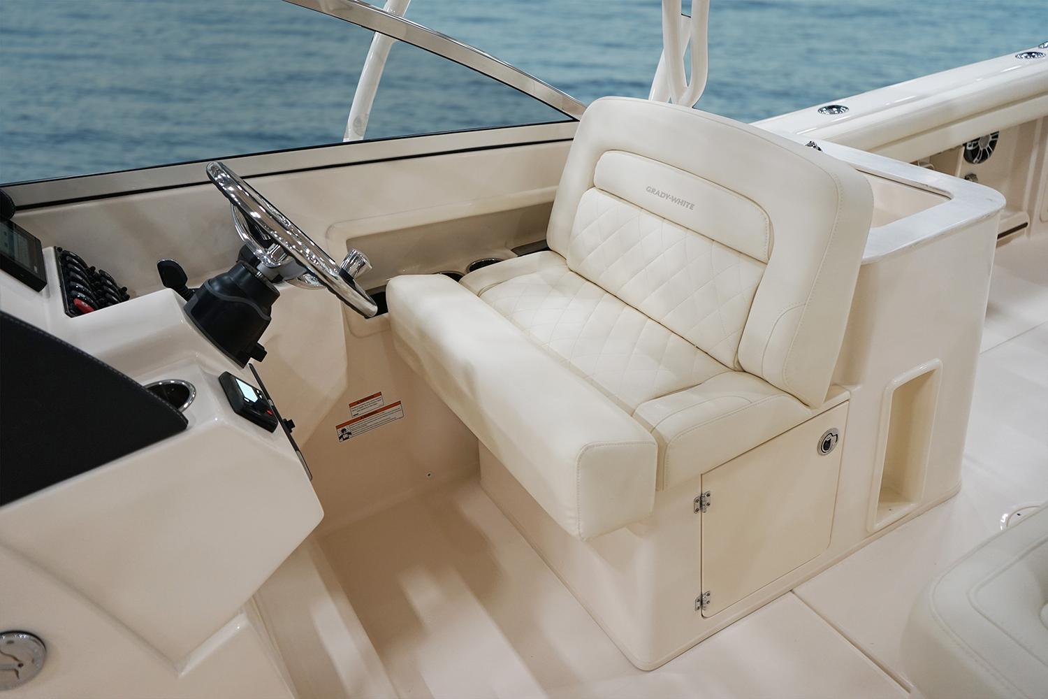 Manufacturer Provided Image: 2023 Grady-White Freedom 275 boat interior with helm seat and steering wheel.