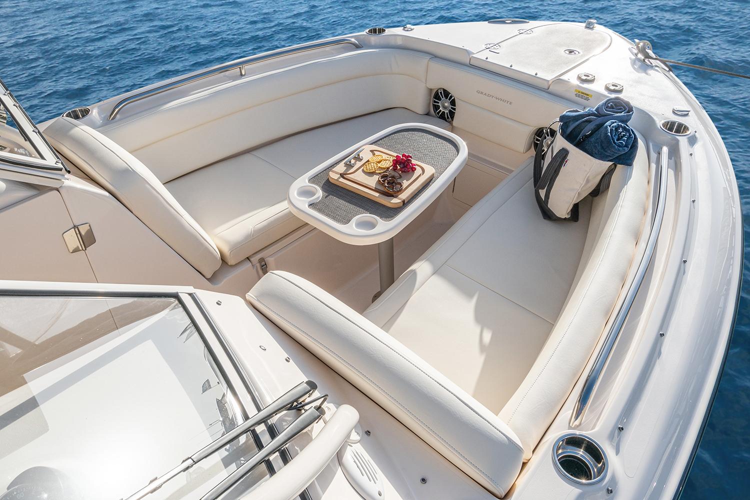 Manufacturer Provided Image: 2023 Grady-White Freedom 275 boat with spacious seating and table on the deck.