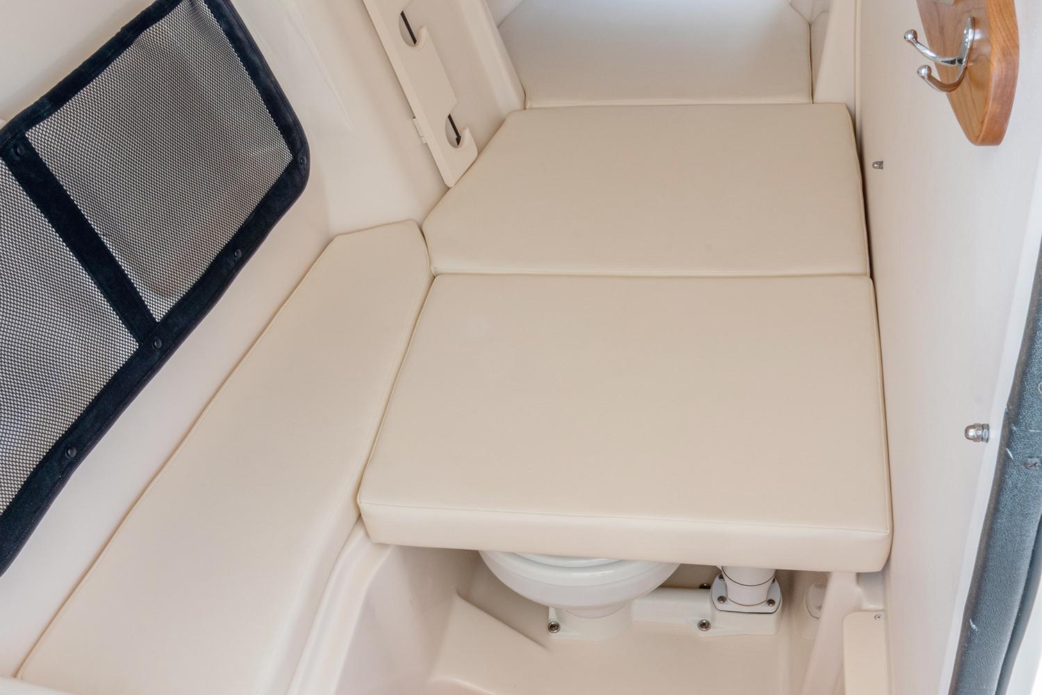 Manufacturer Provided Image: 2023 Grady-White Freedom 307 boat interior with cushioned seating and storage.
