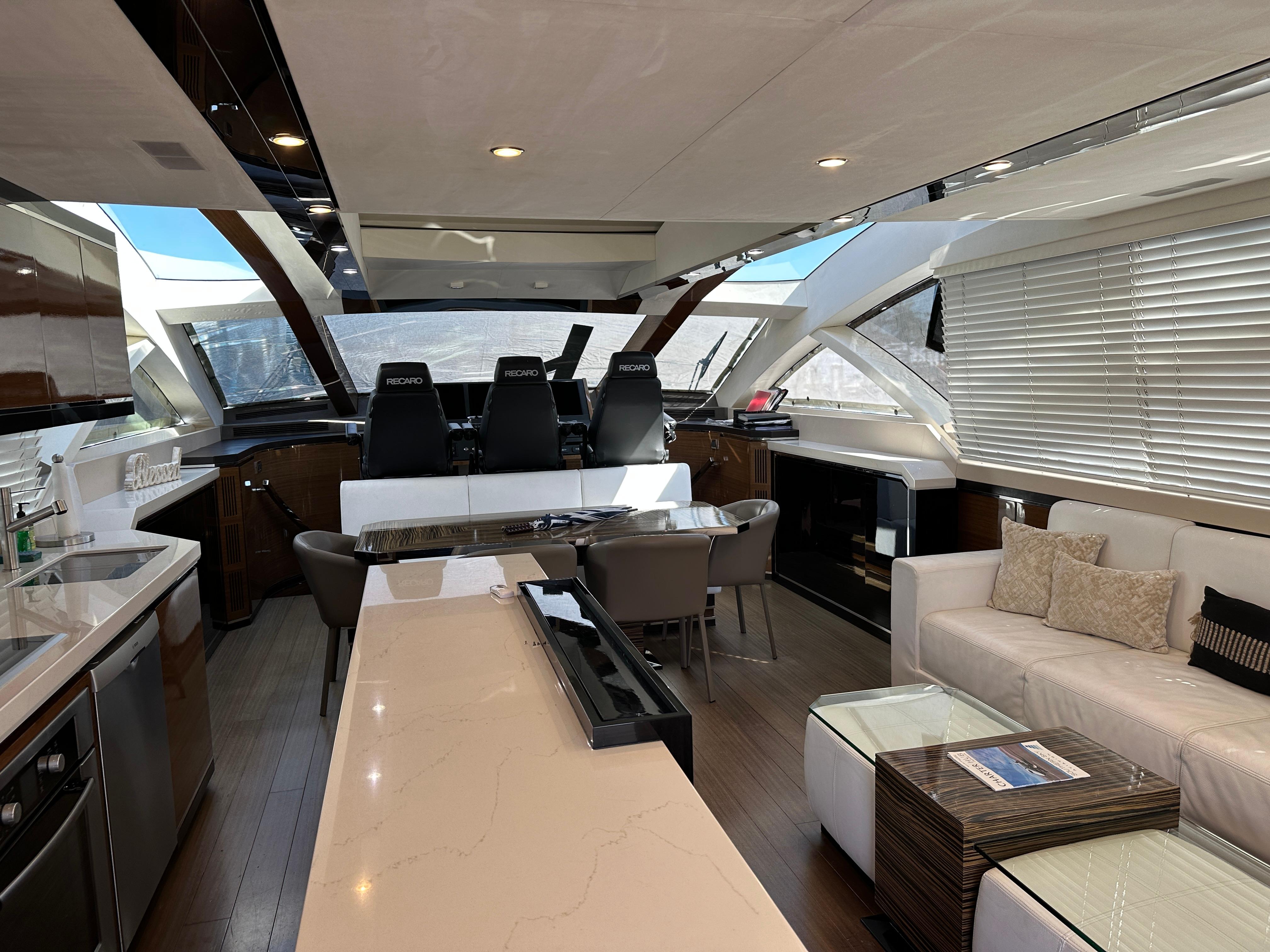 Cheoy Lee-Alpha 87 Express Sportbridge 2014-BBELLA FL-US-Luxurious interior of 2014 Cheoy Lee Alpha 87 Express Sportbridge yacht, featuring modern seating and helm.-9807207 | Thumbnail