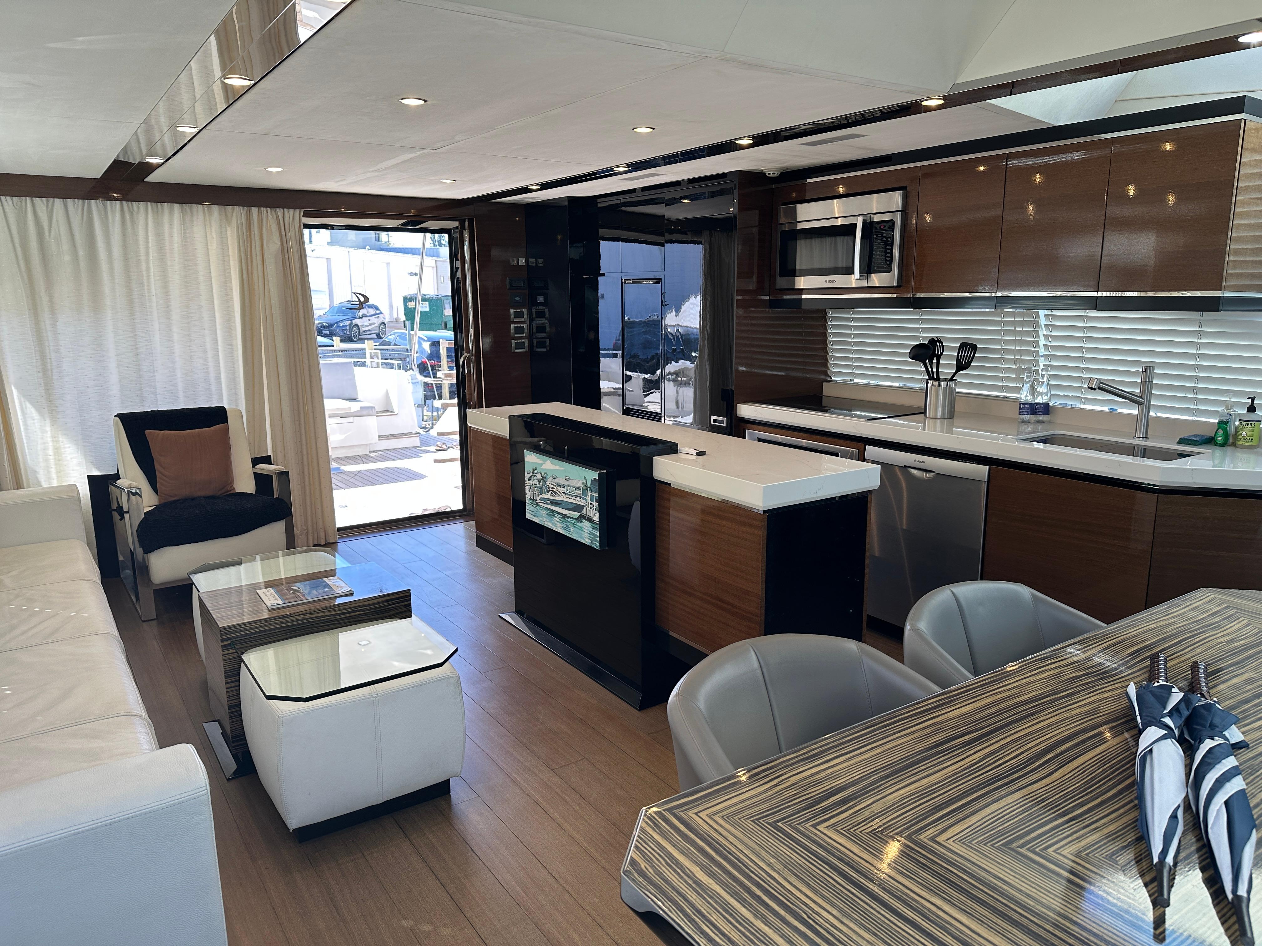 Cheoy Lee-Alpha 87 Express Sportbridge 2014-BBELLA FL-US-Luxurious interior of 2014 Cheoy Lee Alpha 87 Express Sportbridge yacht, featuring modern kitchen and seating area.-9807207 | Thumbnail