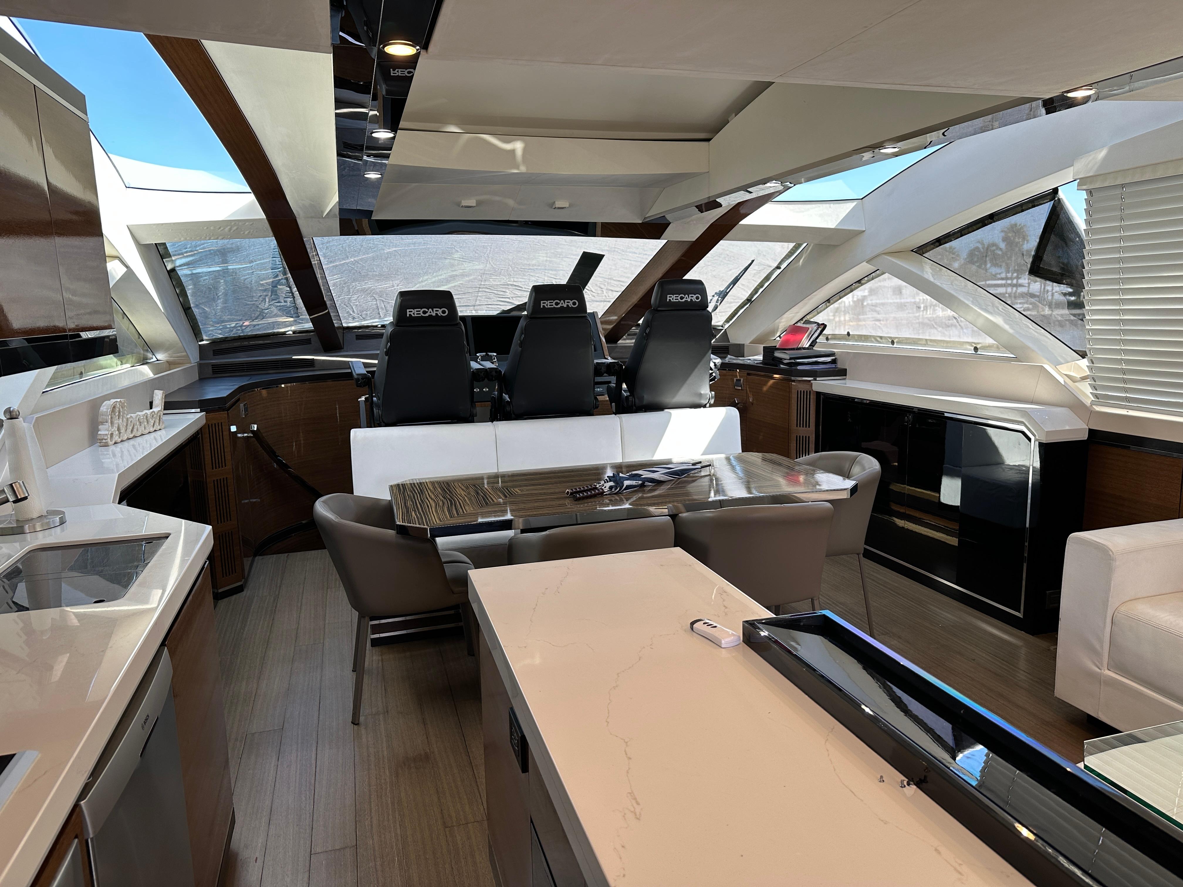 Cheoy Lee-Alpha 87 Express Sportbridge 2014-BBELLA FL-US-Luxurious interior of 2014 Cheoy Lee Alpha 87 Express Sportbridge yacht with modern seating and helm.-9807207 | Thumbnail