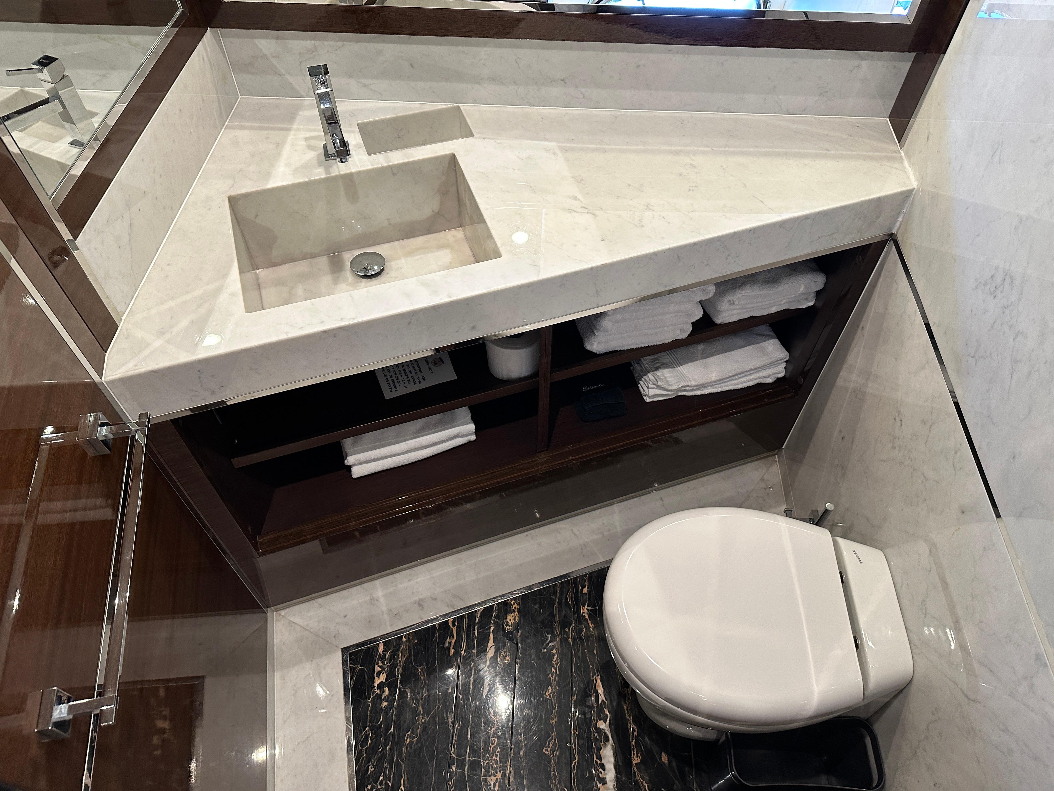 Cheoy Lee-Alpha 87 Express Sportbridge 2014-BBELLA FL-US-Luxurious bathroom in 2014 Cheoy Lee Alpha 87 Express Sportbridge yacht with marble sink and toilet.-9807207 | Thumbnail
