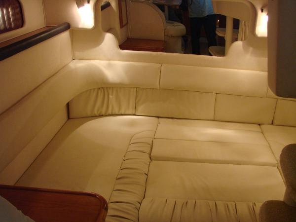 Interior of 2001 Sea Ray 340 Sundancer with beige upholstery.