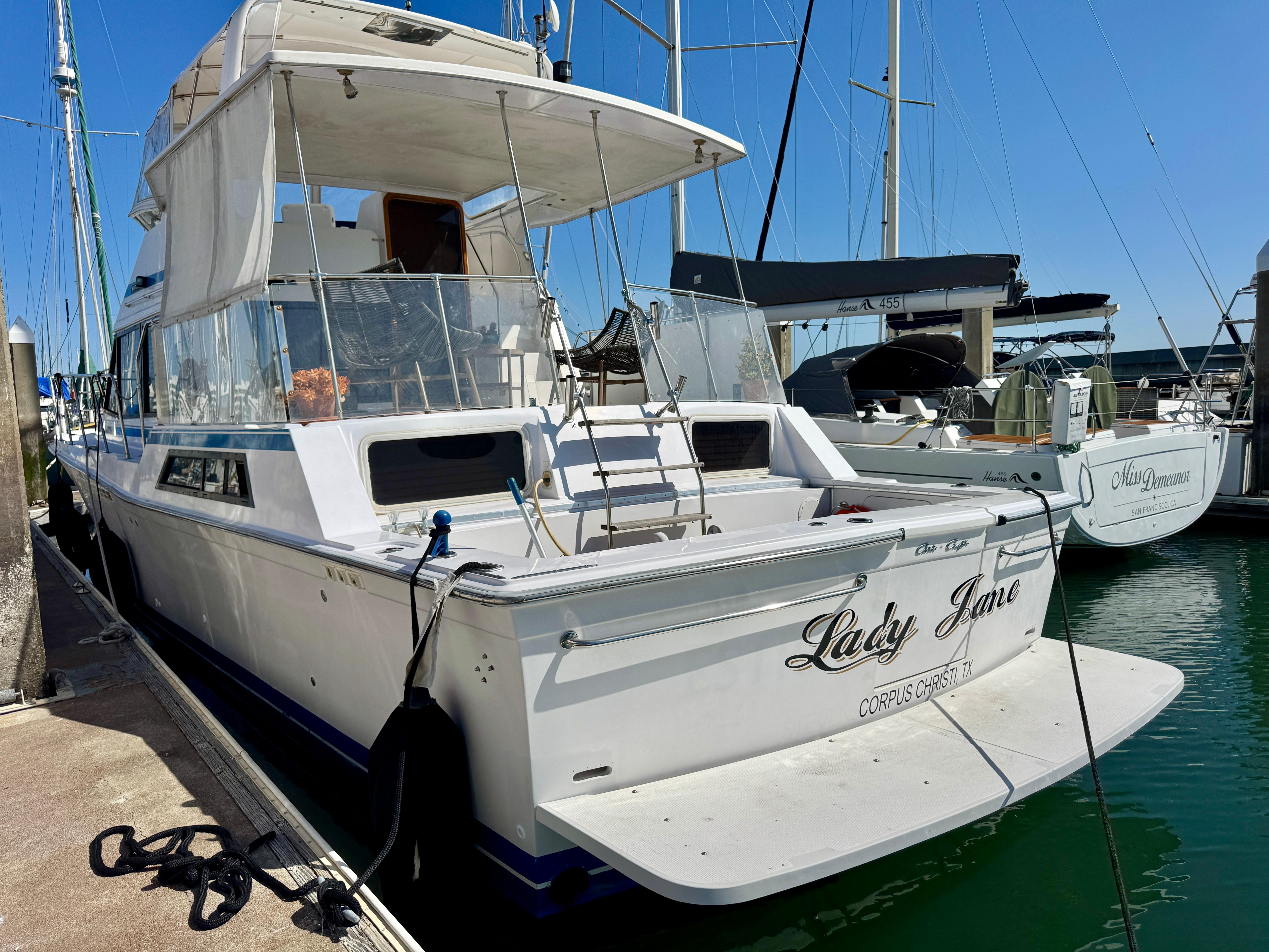 1989 Chris-Craft Catalina boat named "Lady Jane" docked at a marina.