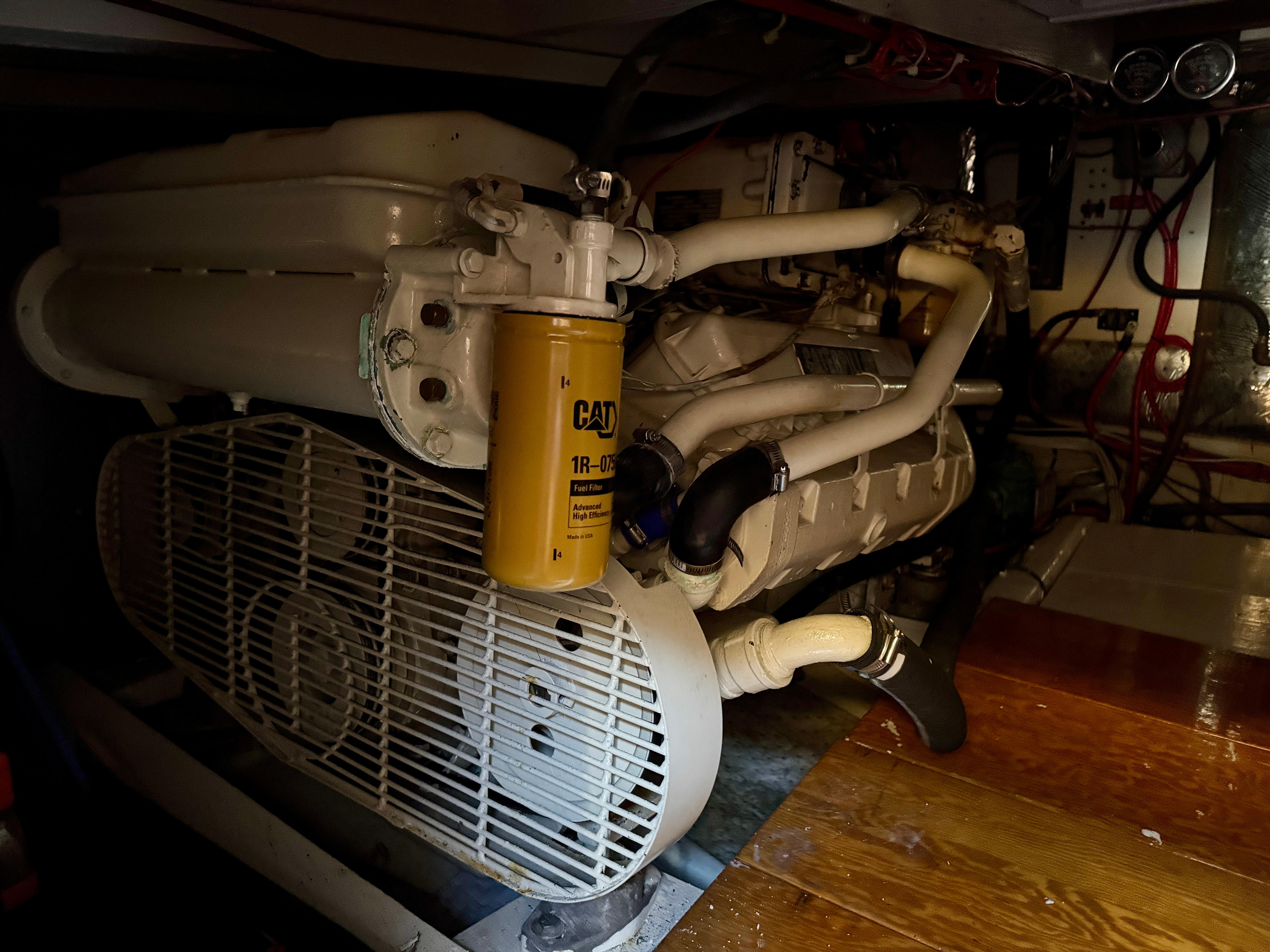 Engine room of 1989 Chris-Craft Catalina boat, featuring detailed mechanical components.