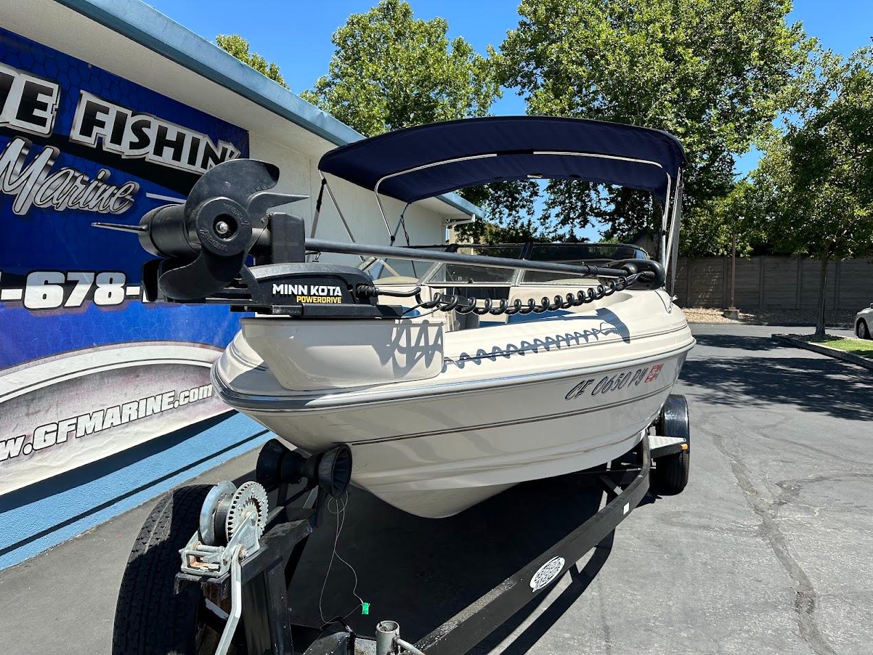 2001 Larson SEi 190 boat with Minn Kota PowerDrive, parked on a trailer.