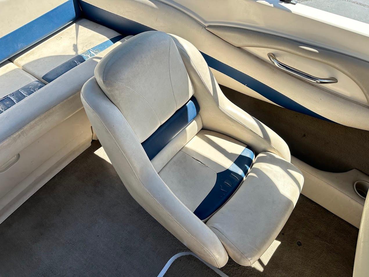 2001 Larson SEi 190 boat interior with white and blue seating.