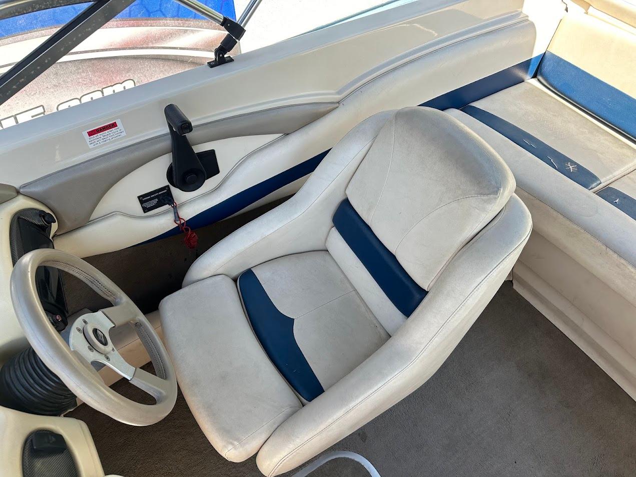2001 Larson SEi 190 boat interior with steering wheel and seating.