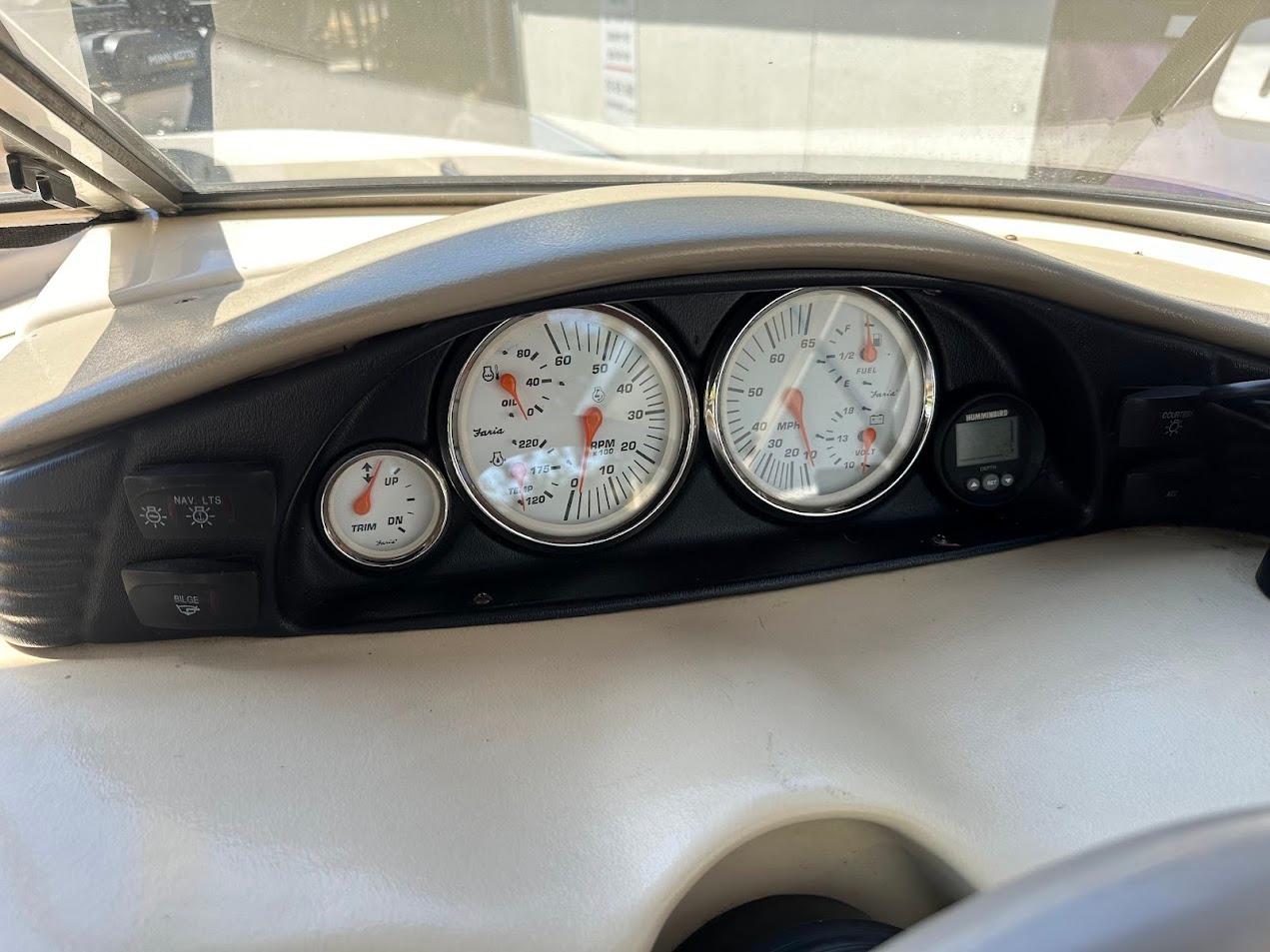 Dashboard of a 2001 Larson SEi 190 boat with gauges and controls.