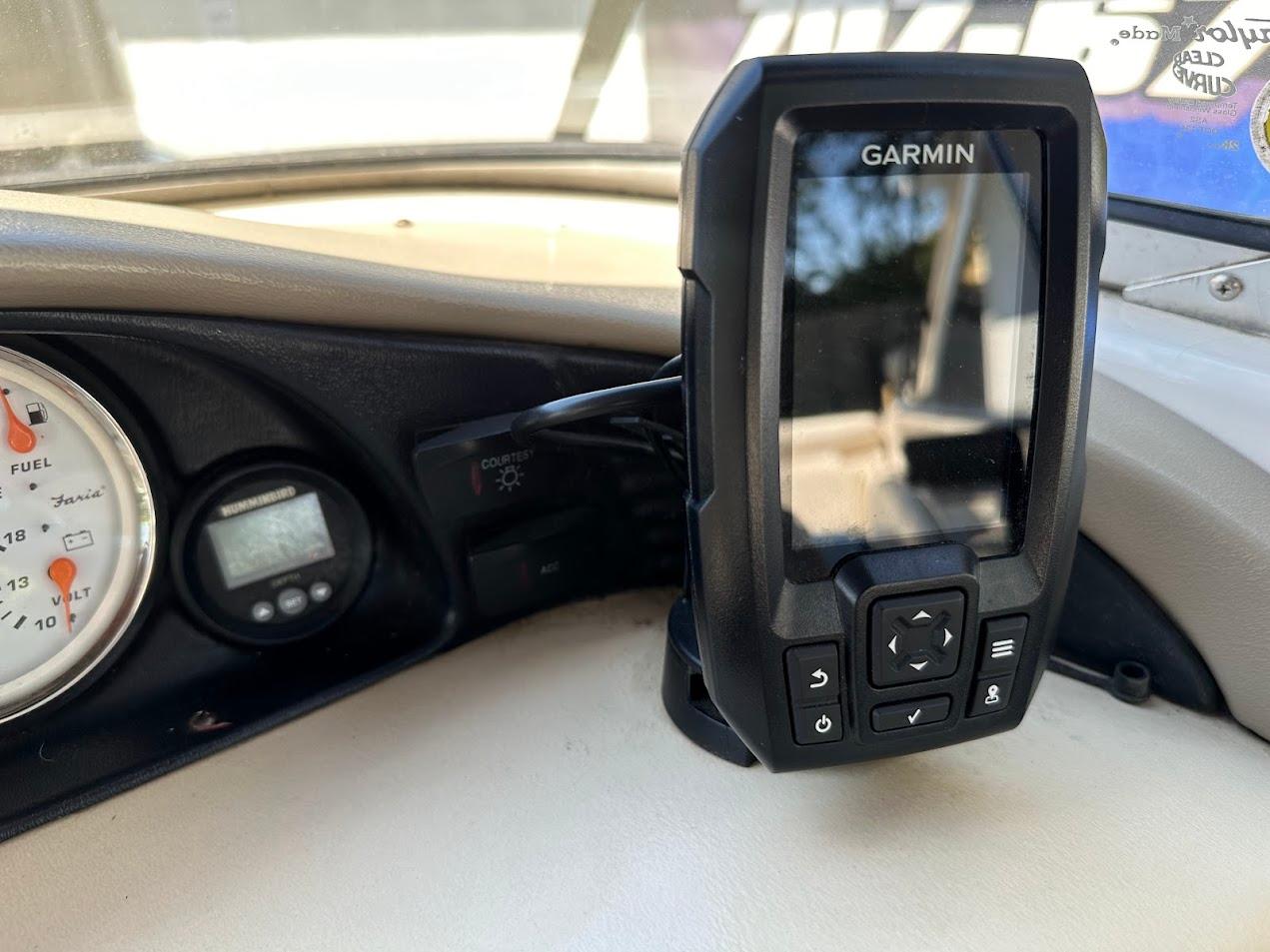 Dashboard of a 2001 Larson SEi 190 boat with Garmin GPS device.