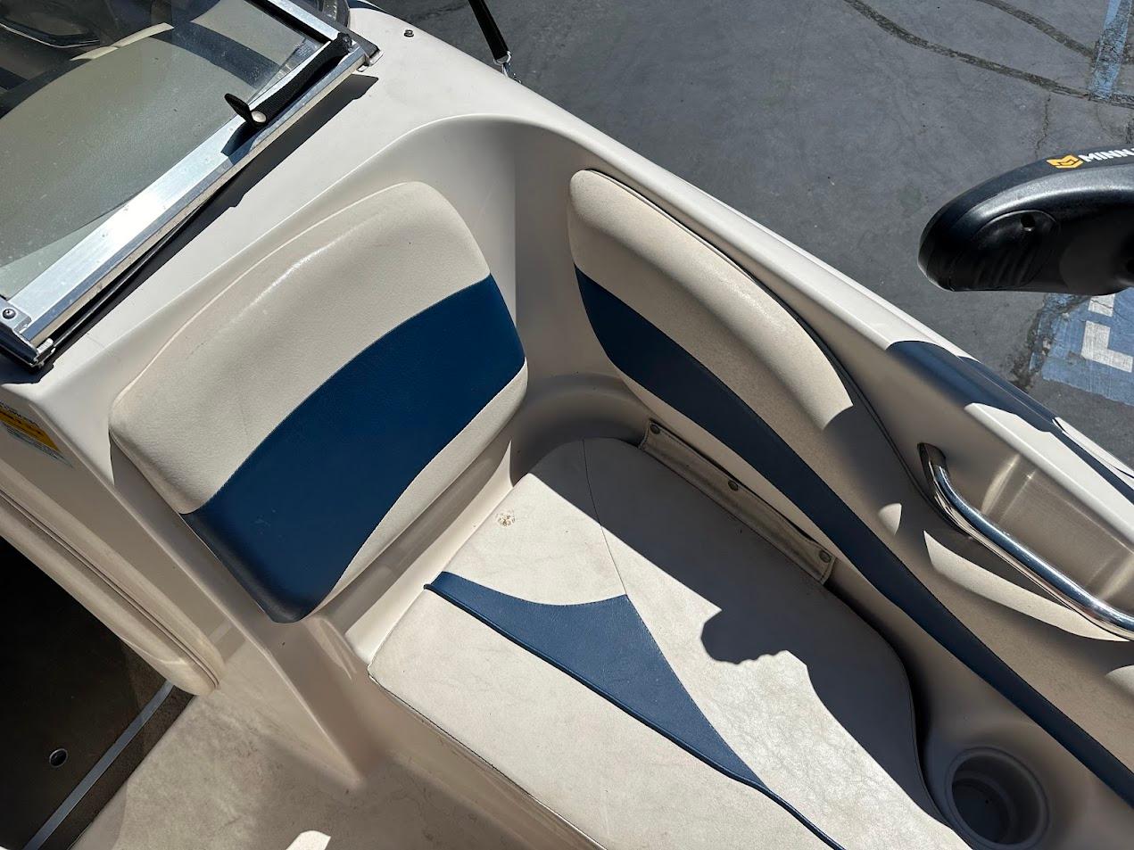 2001 Larson SEi 190 boat interior with blue and white seating.