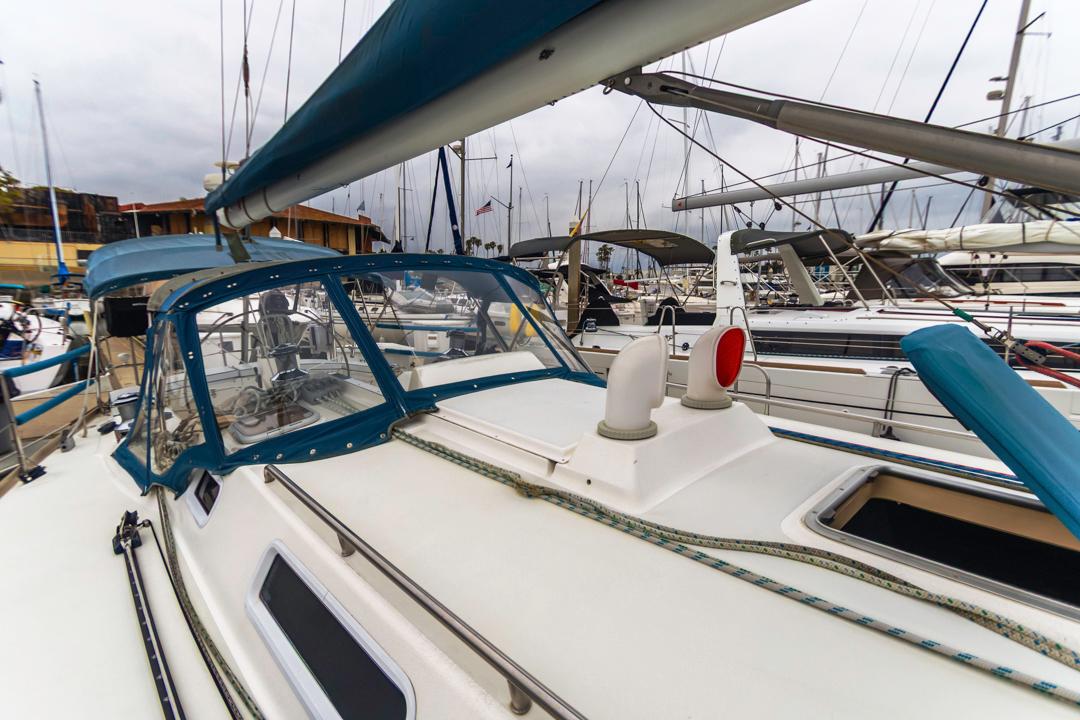 J Boats-46 2001-Lark US-Sailboat J Boats 46, 2001 model, docked in marina with blue canopy and rigging.-9774775 | Thumbnail