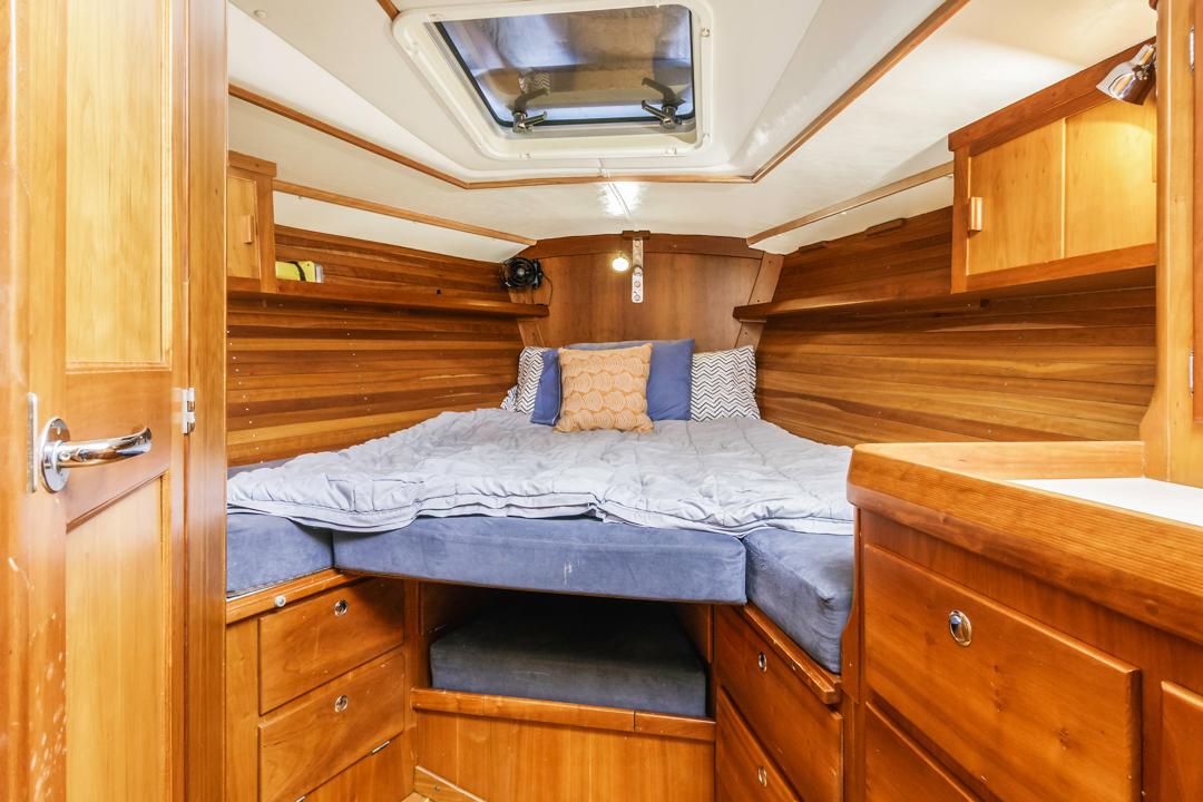 J Boats-46 2001-Lark US-Cozy cabin interior of 2001 J Boats 46, featuring wooden furnishings and a comfortable bed.-9774775 | Thumbnail