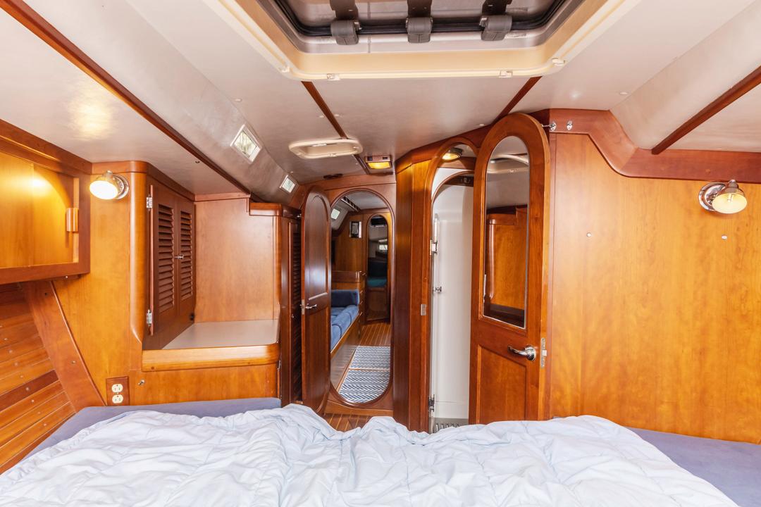 J Boats-46 2001-Lark US-Interior of 2001 J Boats 46 yacht with wooden cabinetry and cozy sleeping area.-9774775 | Thumbnail